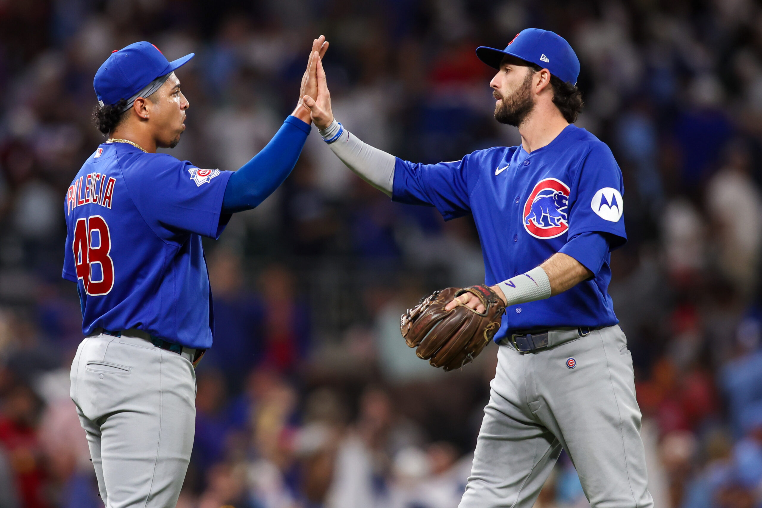 May 14, 2026; Atlanta, Georgia, USA; Chicago Cubs pitcher Daniel Palencia (48) and shortstop Dansby Swanson (7) celebrate after a victory over the Atlanta Braves at Truist Park. Mandatory Credit: Brett Davis-Imagn Images