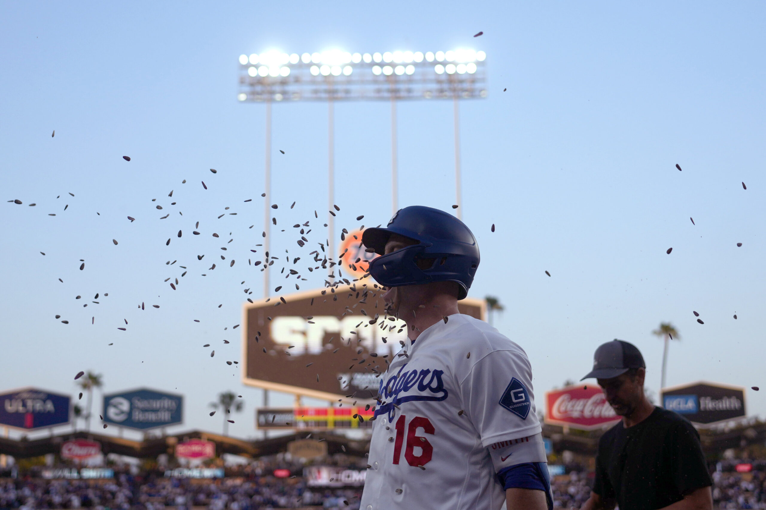 May 14, 2026; Los Angeles, California, USA; Los Angeles Dodgers catcher Will Smith (16) is showered with sunflower seeds after hitting a home run in the first inning against the San Francisco Giants at Dodger Stadium. Mandatory Credit: Kirby Lee-Imagn Images