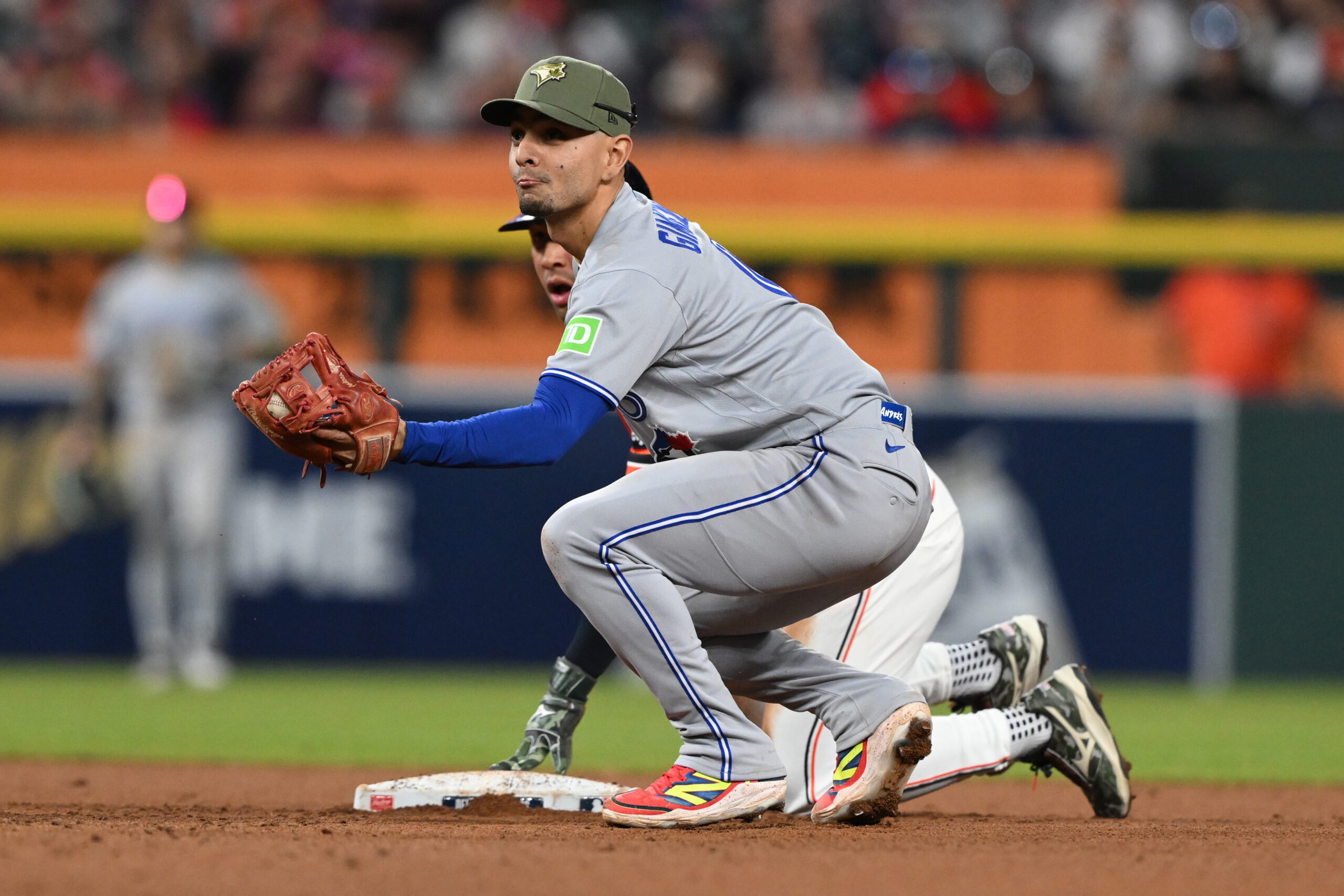 May 15, 2026; Detroit, Michigan, USA;  Toronto Blue Jays shortstop Andrés Giménez (0) tags out Detroit Tigers pinch Jahmai Jones (18) on a steal attempt in the eighth inning at Comerica Park. Mandatory Credit: Lon Horwedel-Imagn Images