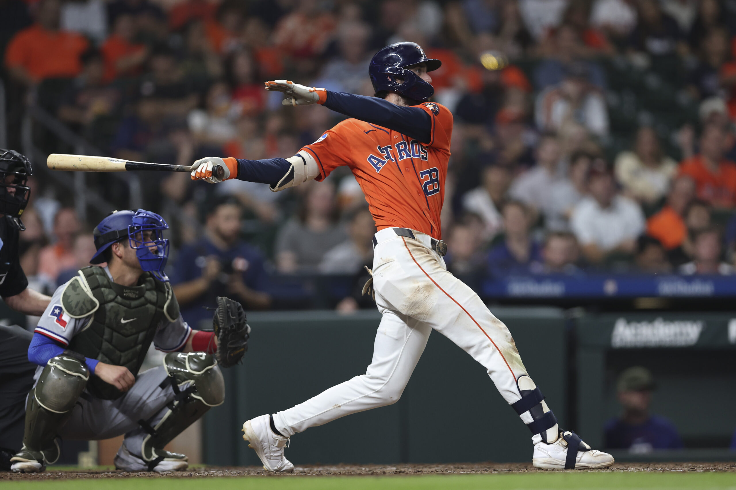 May 15, 2026; Houston, Texas, USA; Houston Astros shortstop Braden Shewmake (28) hits an RBI single during the eighth inning against the Texas Rangers at Daikin Park. Mandatory Credit: Troy Taormina-Imagn Images