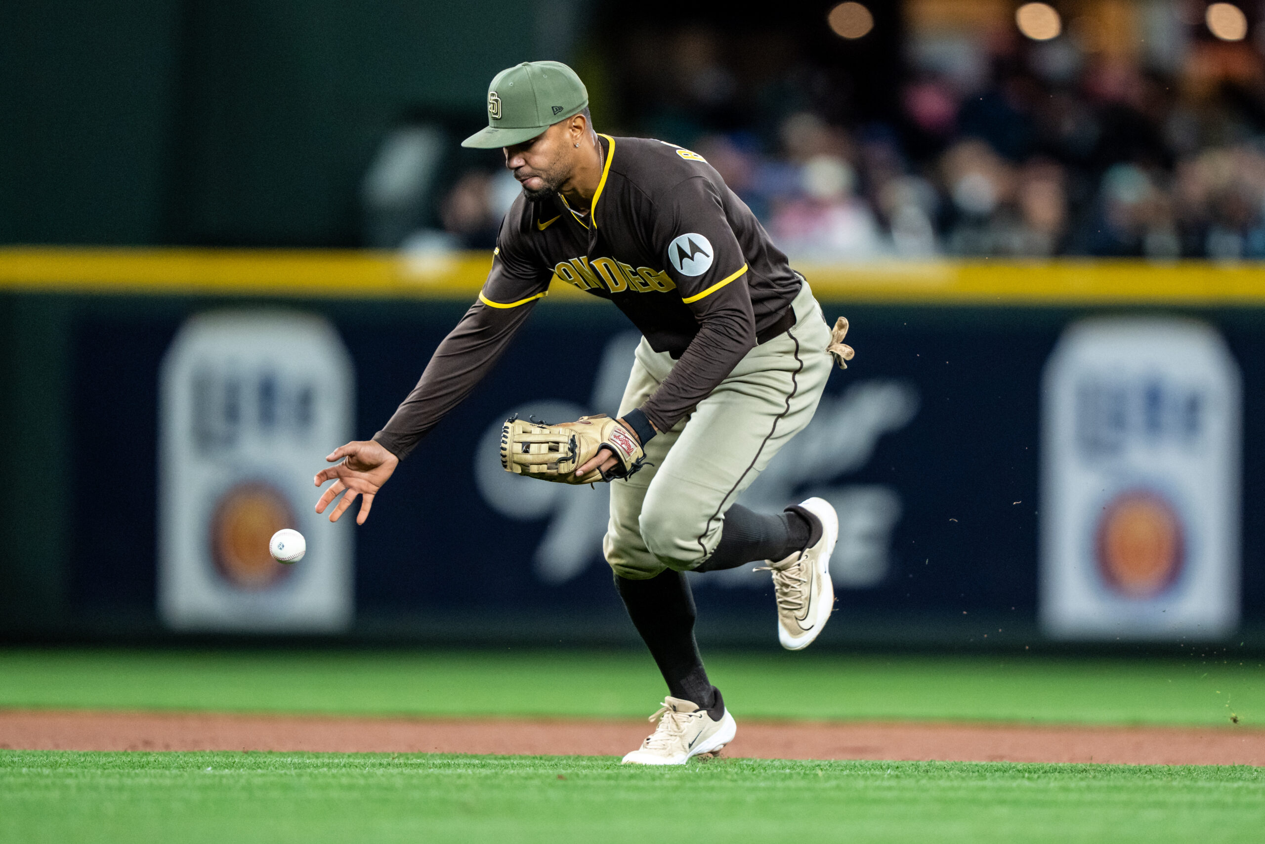 May 15, 2026; Seattle, Washington, USA; San Diego Padres shortstop Xander Bogaerts (2) attempts to field a ground ball barehanded during the eighth inning against the Seattle Mariners at T-Mobile Park. Mandatory Credit: Stephen Brashear-Imagn Images