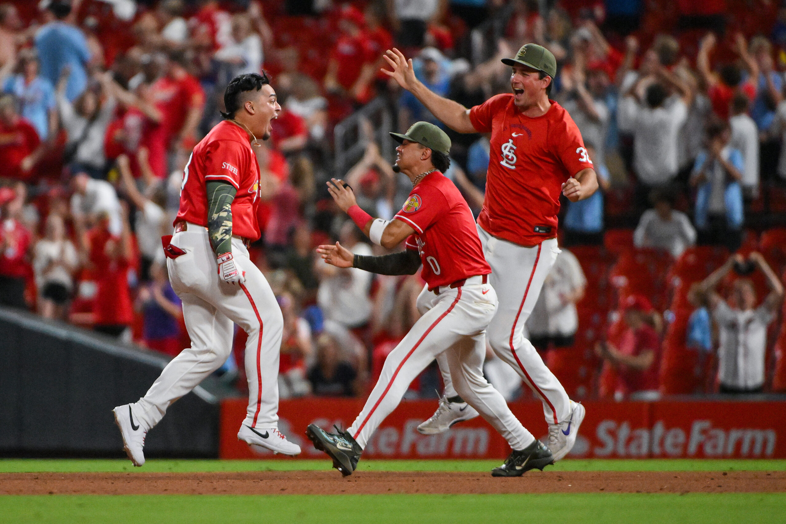 May 15, 2026; St. Louis, Missouri, USA; St. Louis Cardinals pinch hitter Yohel Pozo (63) celebrates with teammates after hitting a wall-off one run single against the Kansas City Royals during the eleventh inning at Busch Stadium. Mandatory Credit: Jeff Curry-Imagn Images