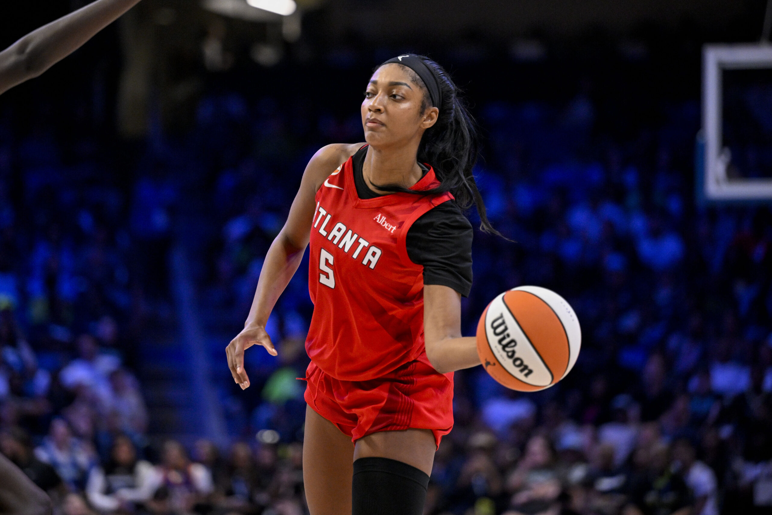 May 12, 2026; Arlington, Texas, USA; Atlanta Dream forward Angel Reese (5) passes the ball during the game between the Wings and the Dream at College Park Center. Mandatory Credit: Jerome Miron-Imagn Images