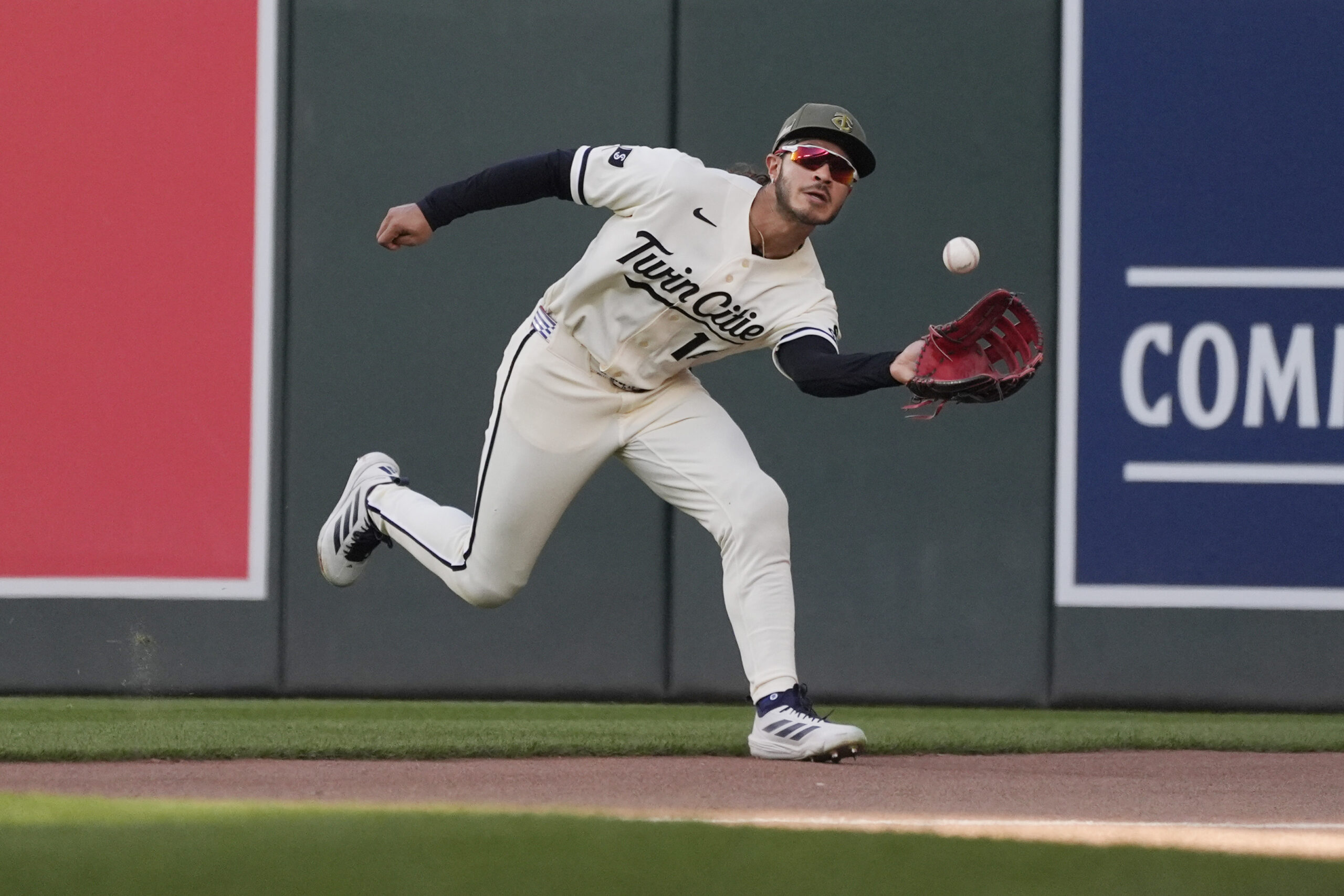 May 16, 2026; Minneapolis, Minnesota, USA; Minnesota Twins shortstop Austin Martin (16) catches a fly ball hit by Milwaukee Brewers catcher Gary Sanchez (not pictured) in the second inning at Target Field. Mandatory Credit: Bruce Kluckhohn-Imagn Images