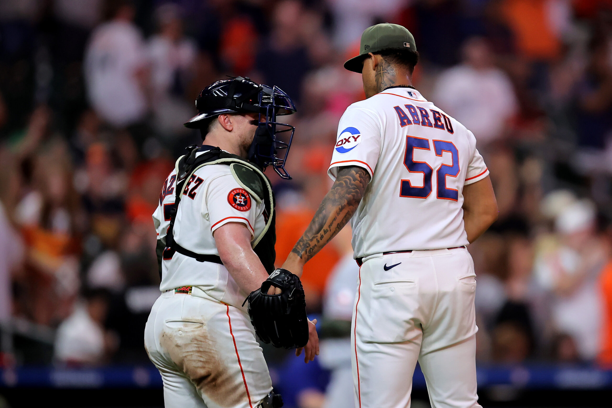 May 16, 2026; Houston, Texas, USA; Houston Astros pitcher Bryan Abreu (52) and catcher Christian Vasquez (2) congratulate each other after the final out against the Texas Rangers during the ninth inning at Daikin Park. Mandatory Credit: Erik Williams-Imagn Images