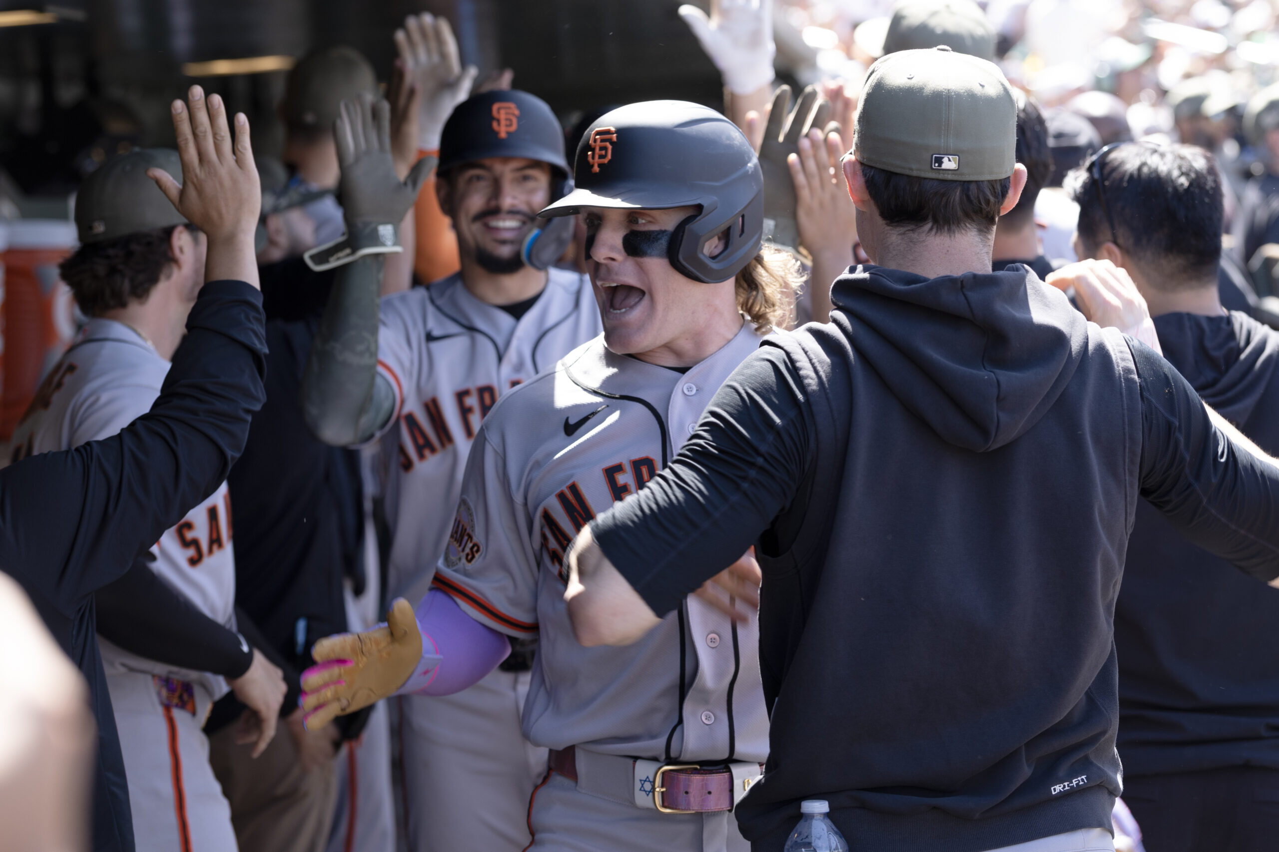 May 17, 2026; West Sacramento, California, USA; San Francisco Giants center fielder Harrison Bader (right, facing) celebrates his grand slam during the eighth inning against the Athletics at Sutter Health Park. Mandatory Credit: D. Ross Cameron-Imagn Images