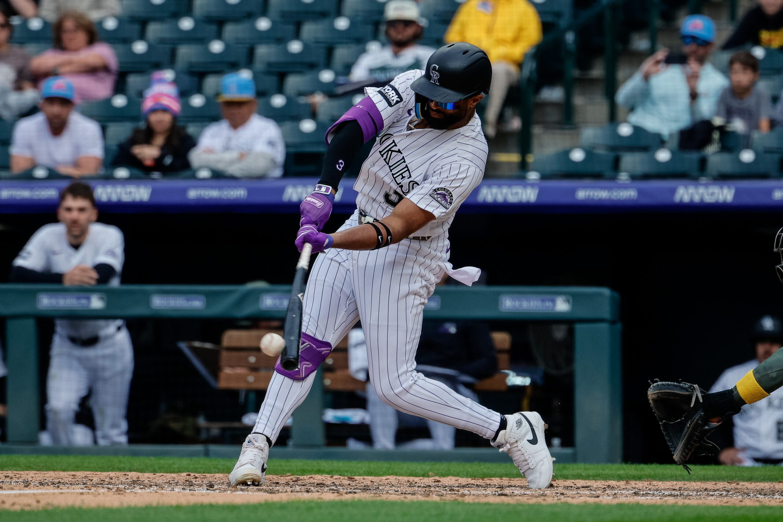 May 17, 2026; Denver, Colorado, USA; Colorado Rockies shortstop Willi Castro (3) hits a sacrifice fly RBI in the eighth inning against the Arizona Diamondbacks at Coors Field. Mandatory Credit: Isaiah J. Downing-Imagn Images