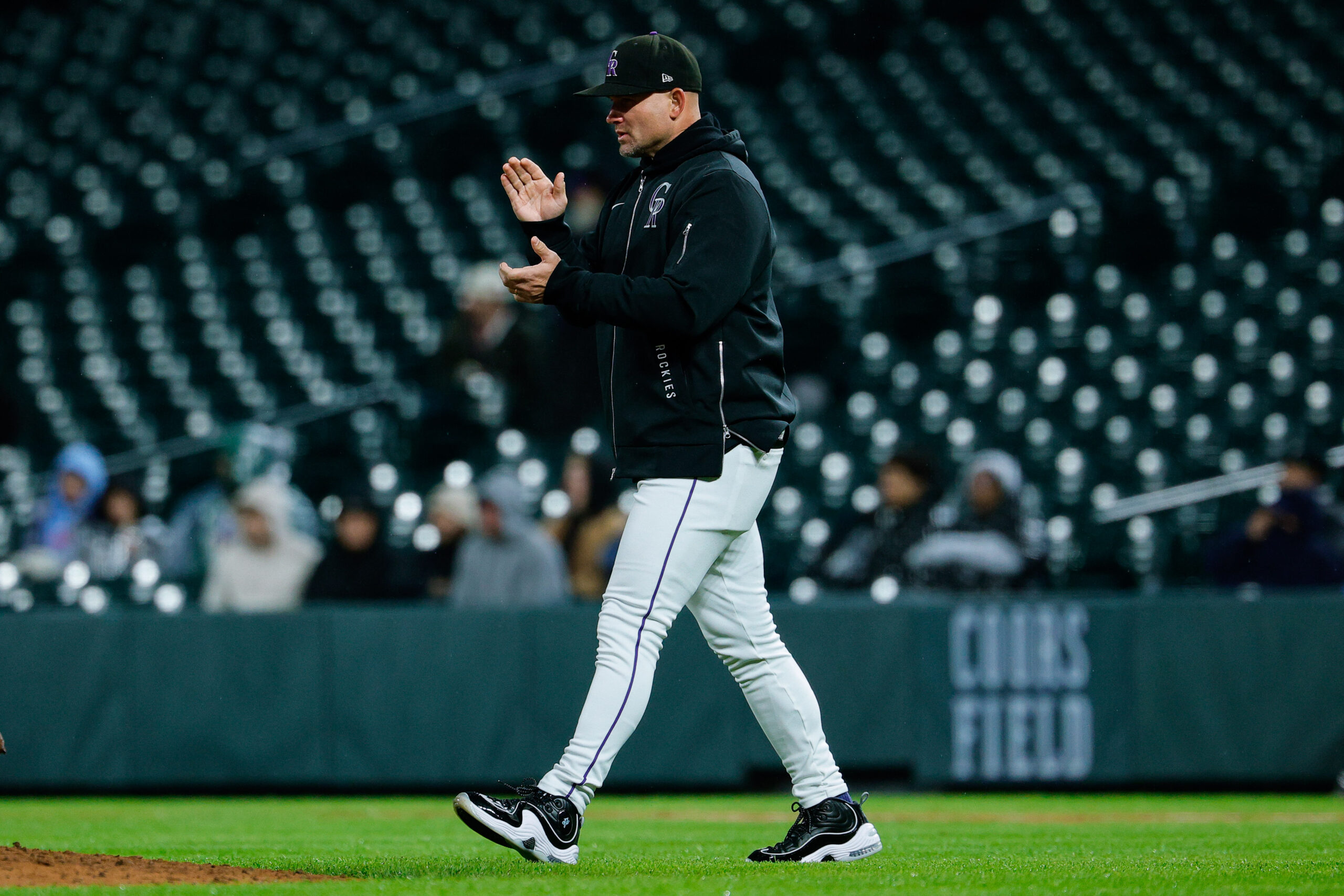 May 18, 2026; Denver, Colorado, USA; Colorado Rockies manager Warren Schaeffer (4) walks to the mound for a pitching change in the fifth inning against the Texas Rangers at Coors Field. Mandatory Credit: Isaiah J. Downing-Imagn Images