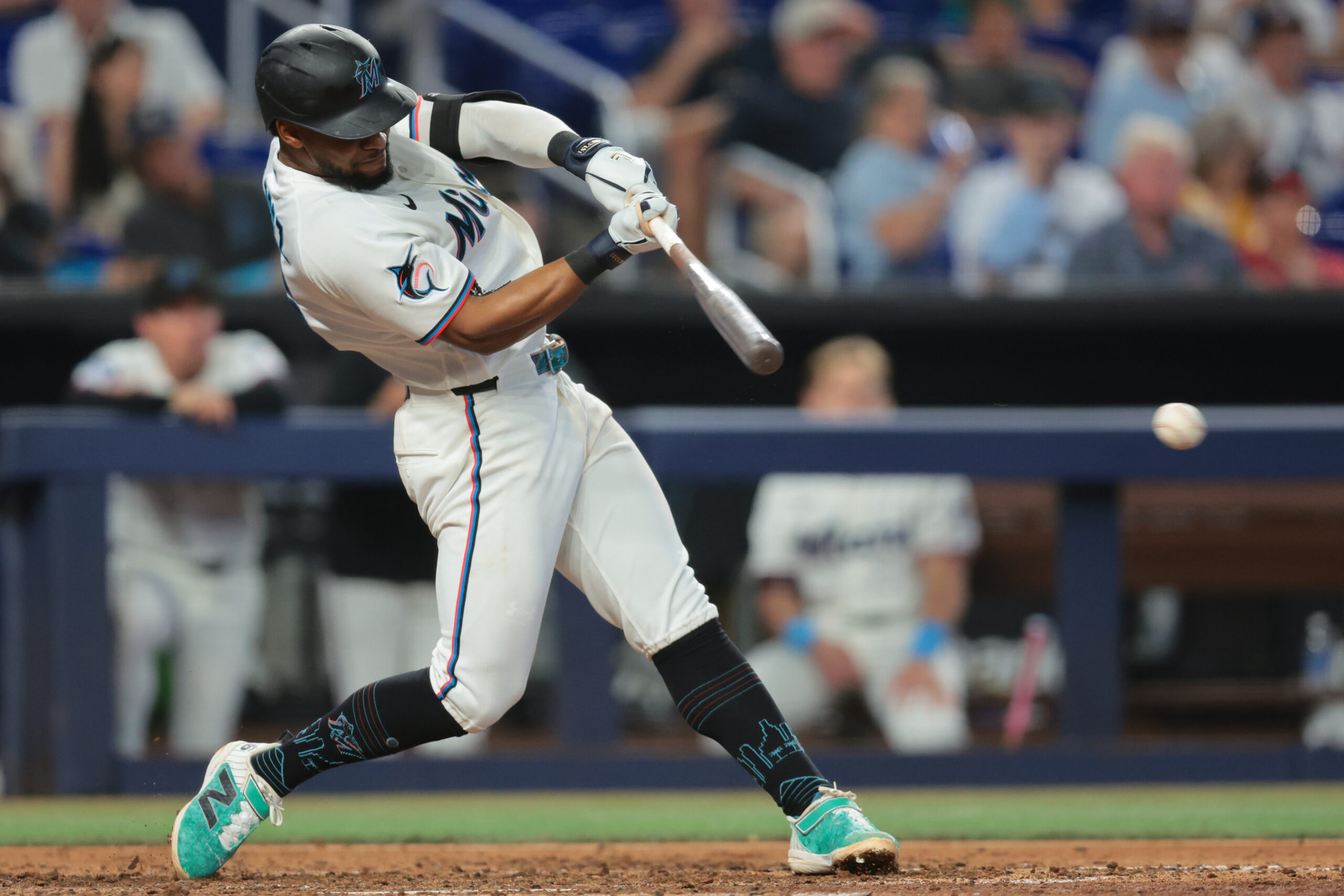 May 19, 2026; Miami, Florida, USA; Miami Marlins shortstop Otto Lopez (6) hits a single against the Atlanta Braves during the fifth inning at loanDepot Park. Mandatory Credit: Sam Navarro-Imagn Images