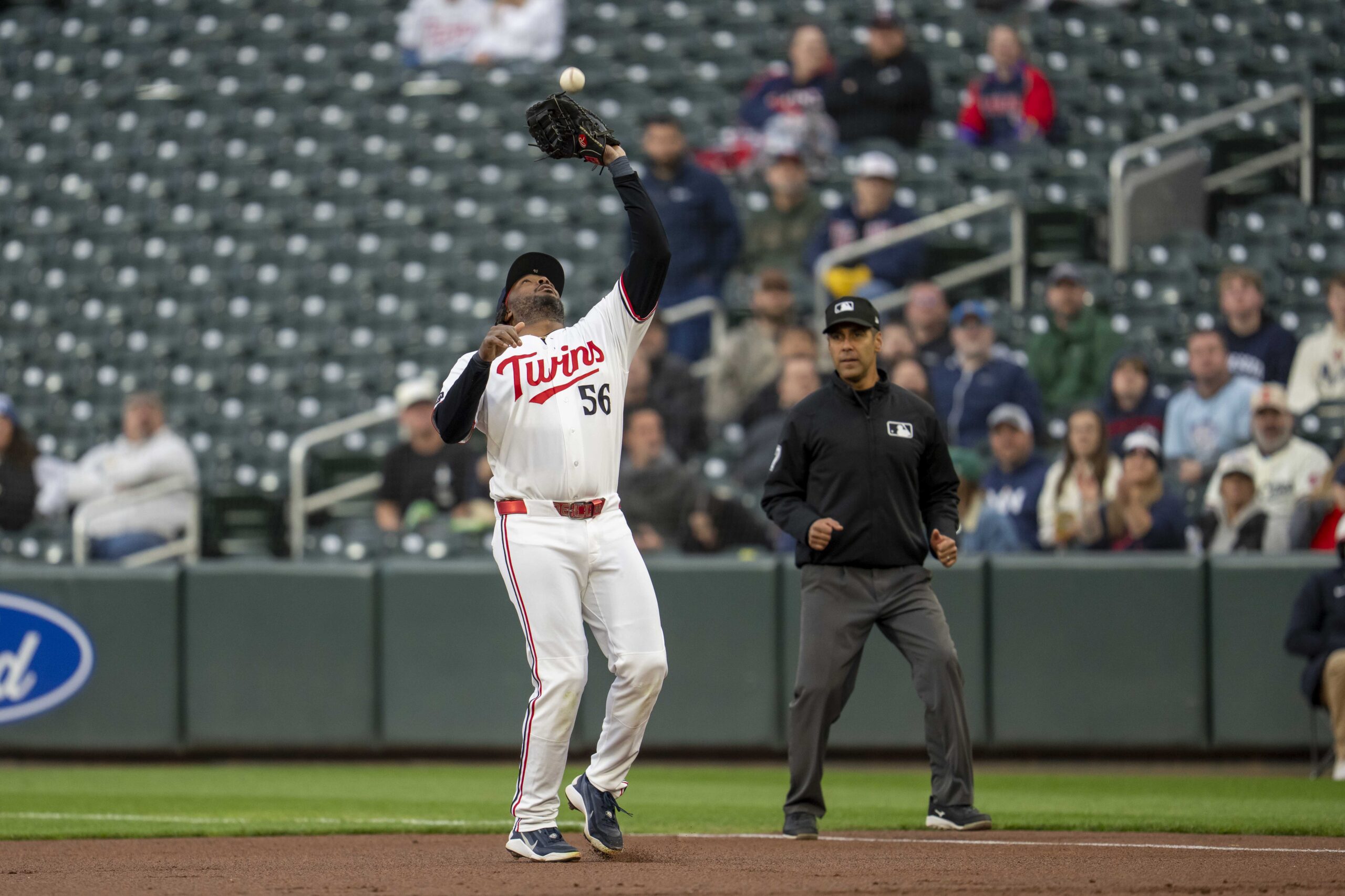 May 19, 2026; Minneapolis, Minnesota, USA; Minnesota Twins first baseman Josh Bell (56) catches a fly ball against the Houston Astros in the first inning at Target Field. Mandatory Credit: Jesse Johnson-Imagn Images
