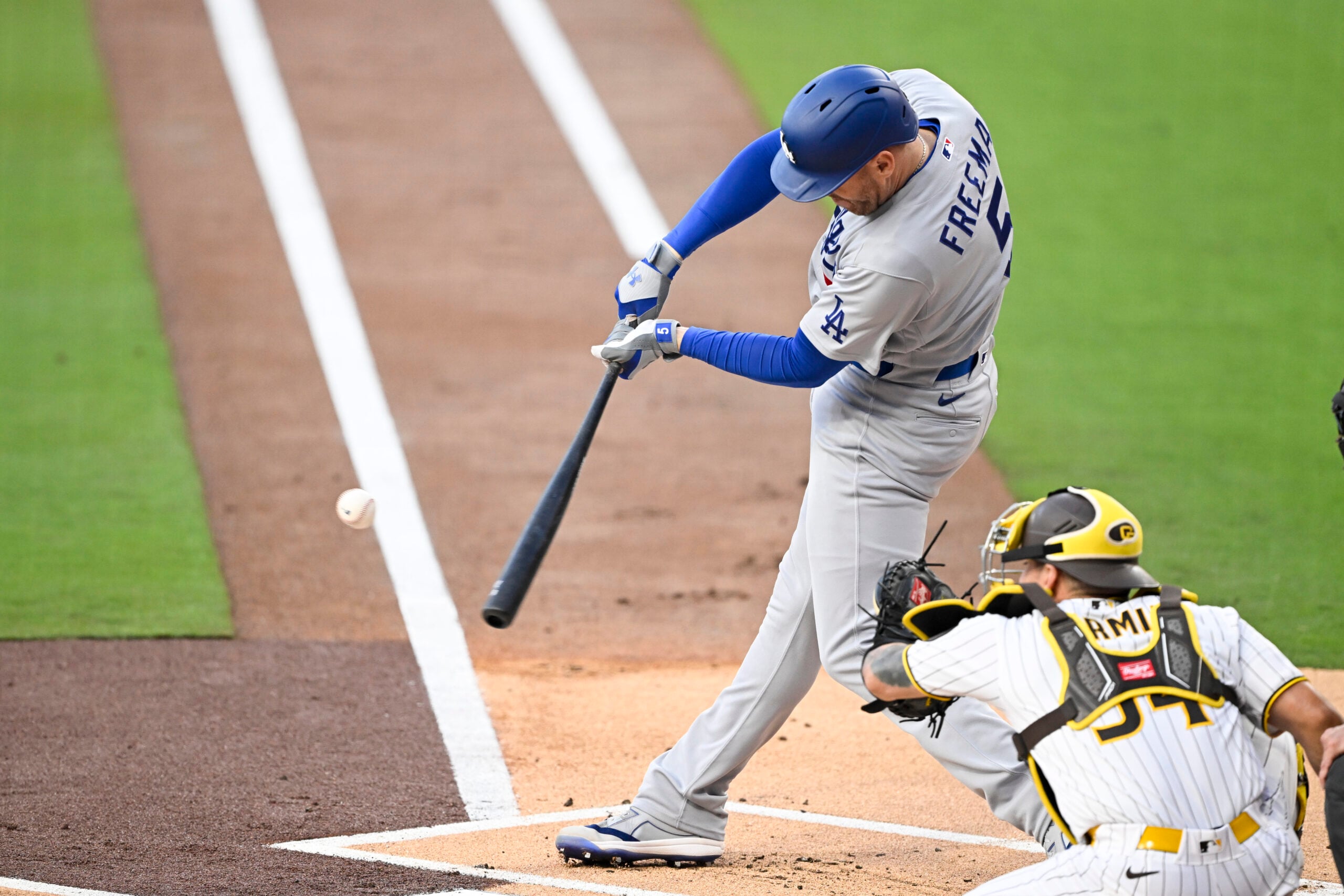 May 19, 2026; San Diego, California, USA; Los Angeles Dodgers first baseman Freddie Freeman (5) hits a two-run home run during the first inning against the San Diego Padres at Petco Park. Mandatory Credit: Denis Poroy-Imagn Images