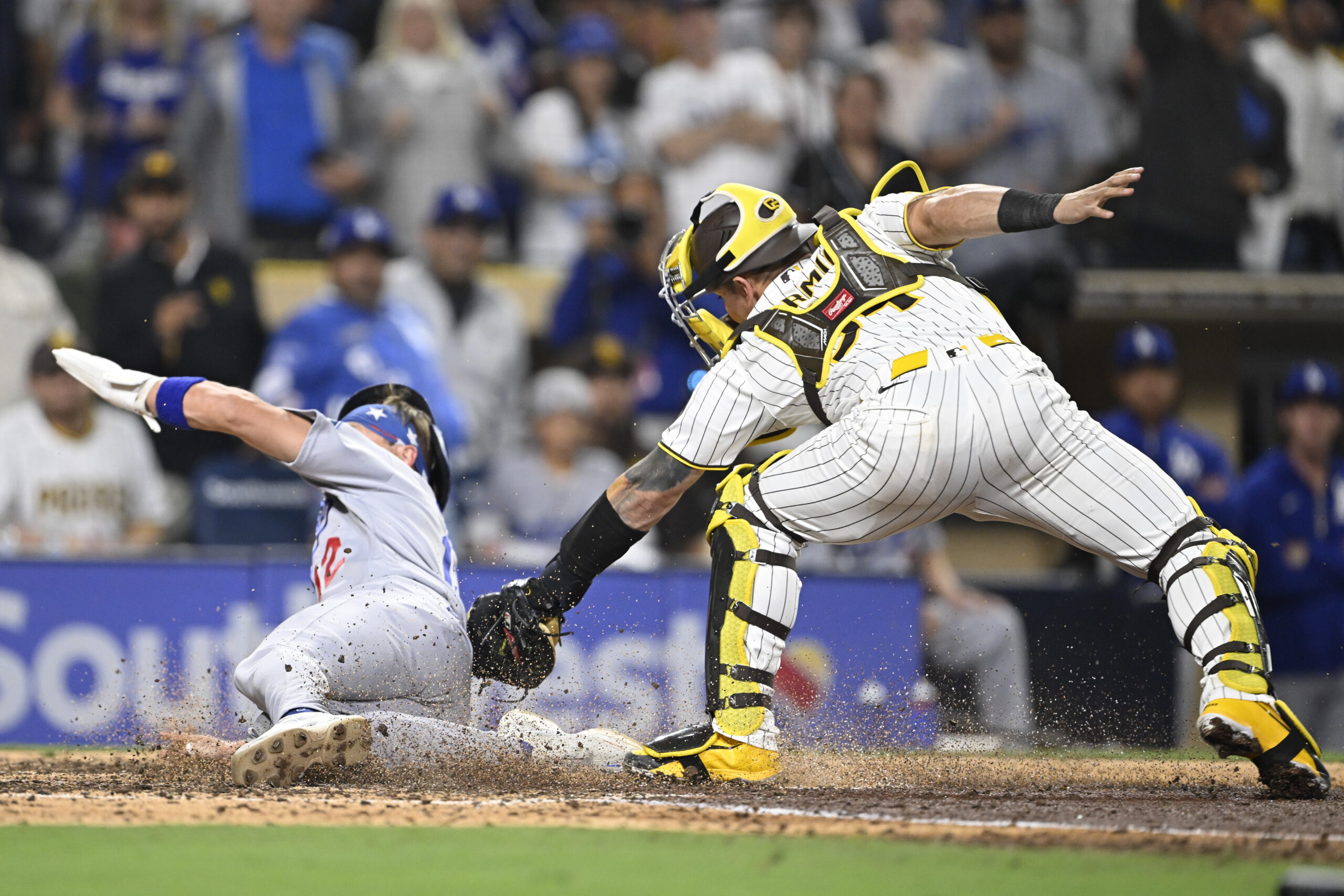 May 19, 2026; San Diego, California, USA; Los Angeles Dodgers left fielder Alex Call (12) scores ahead of the tag of San Diego Padres catcher Freddy Fermin (54) during the ninth inning at Petco Park. Mandatory Credit: Denis Poroy-Imagn Images