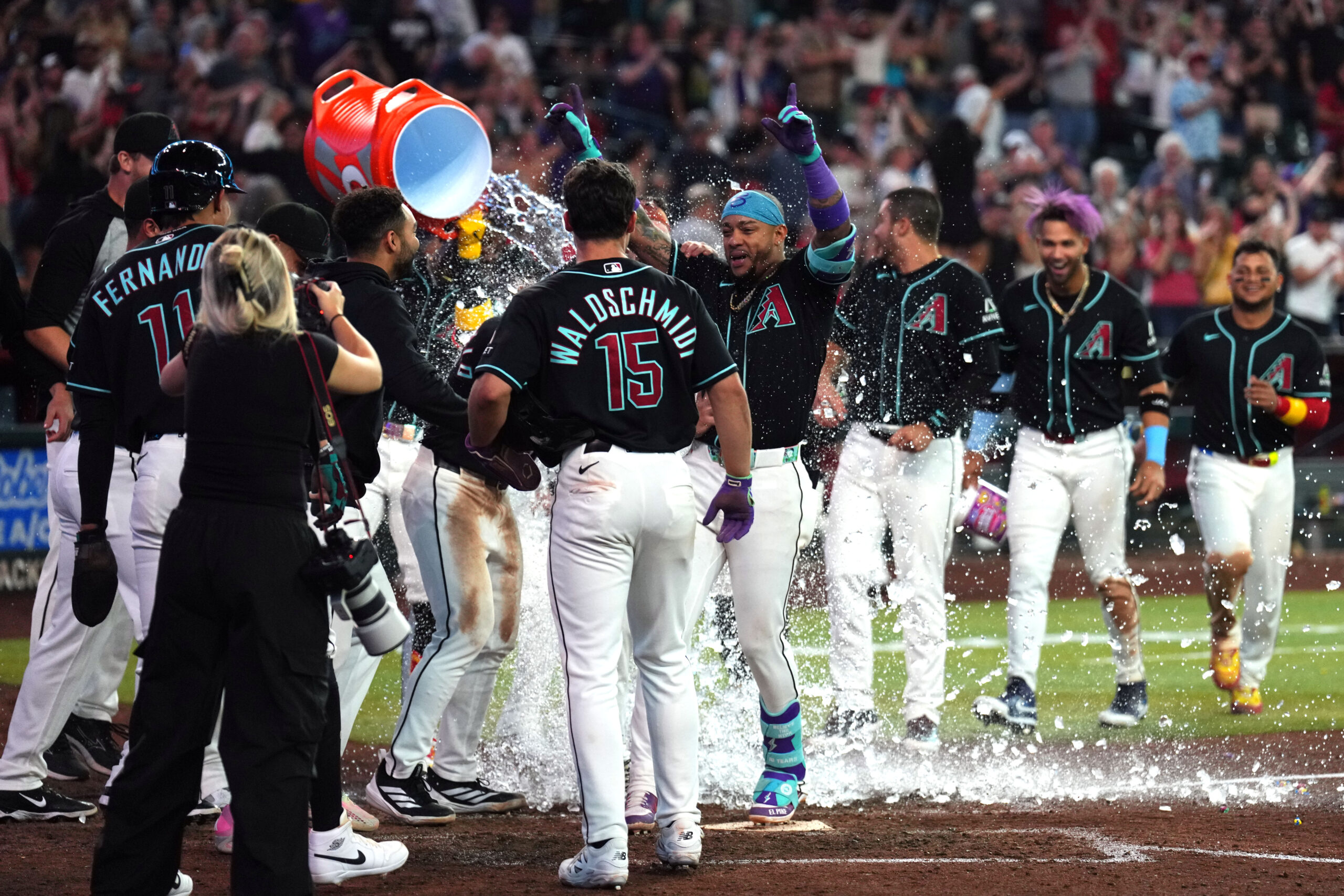 May 19, 2026; Phoenix, Arizona, USA; Arizona Diamondbacks second baseman Ketel Marte (4) is doused with water by teammates after hitting a three run walk off home run against the San Francisco Giants during the ninth inning at Chase Field. Mandatory Credit: Joe Camporeale-Imagn Images