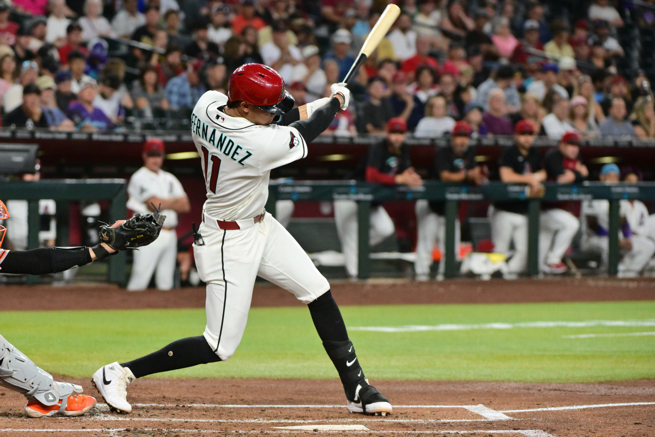 May 20, 2026; Phoenix, Arizona, USA;  Arizona Diamondbacks designated hitter Jose Fernandez (11) singles in the second inning against the San Francisco Giants at Chase Field. Mandatory Credit: Matt Kartozian-Imagn Images