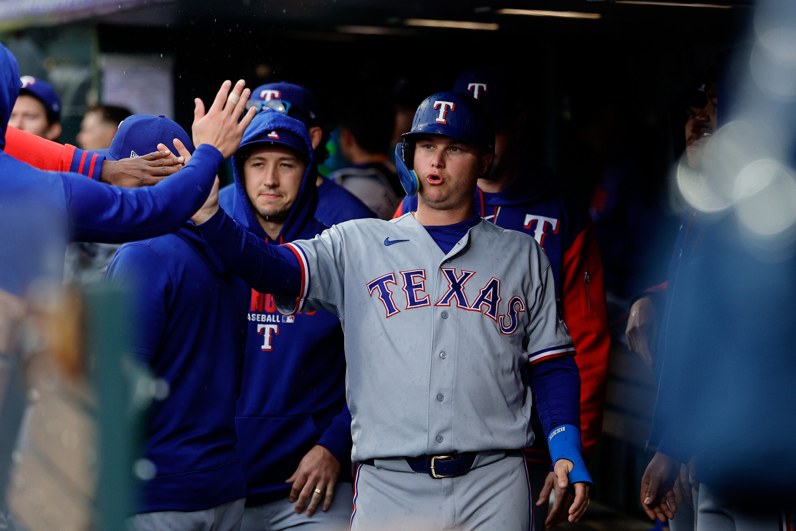 May 20, 2026; Denver, Colorado, USA; Texas Rangers designated hitter Joc Pederson (3) celebrates in the dugout after scoring in the ninth inning against the Colorado Rockies at Coors Field. Mandatory Credit: Isaiah J. Downing-Imagn Images