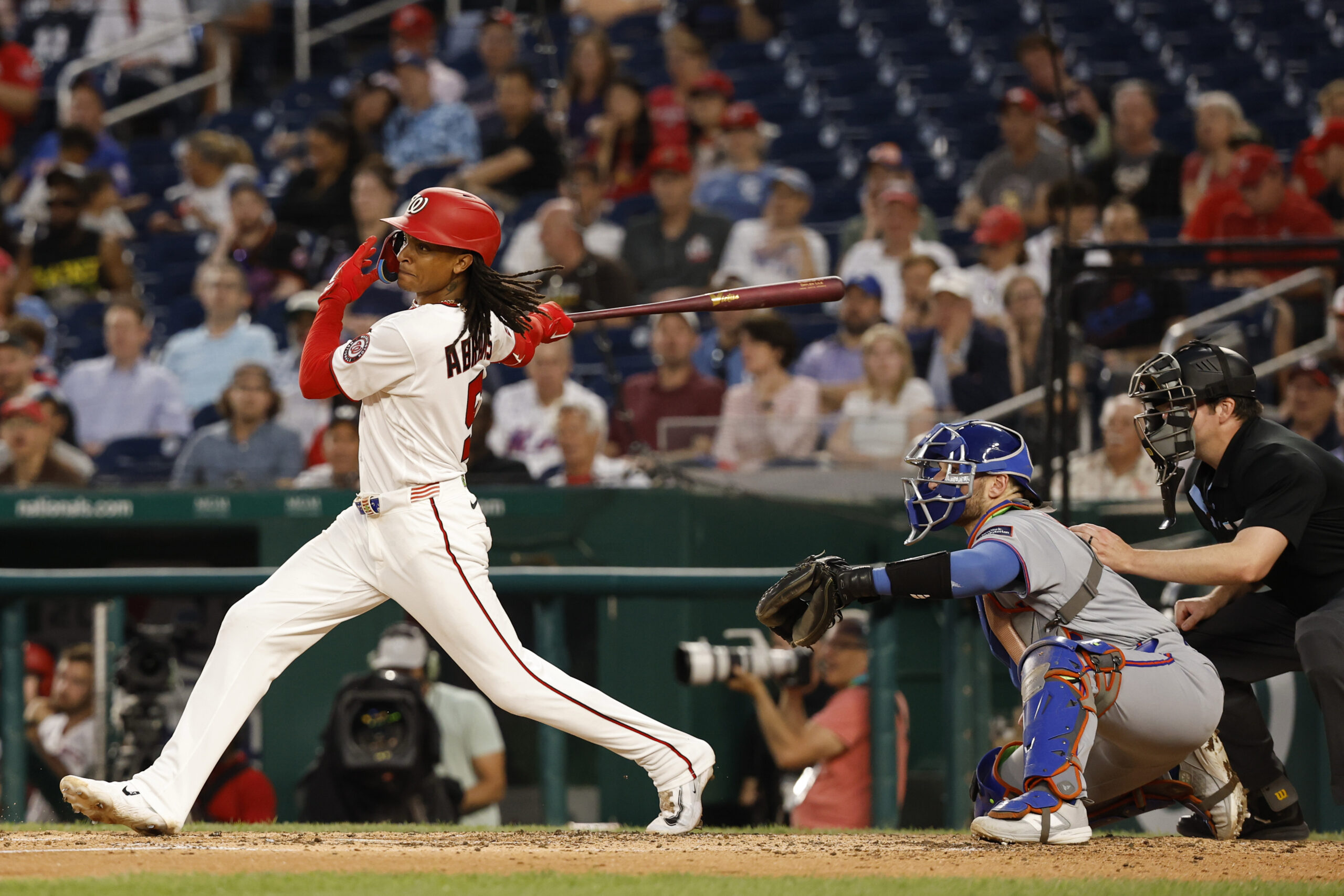 May 20, 2026; Washington, District of Columbia, USA; Washington Nationals shortstop CJ Abrams (5) singles against the New York Mets during the sixth inning at Nationals Park. Mandatory Credit: Geoff Burke-Imagn Images