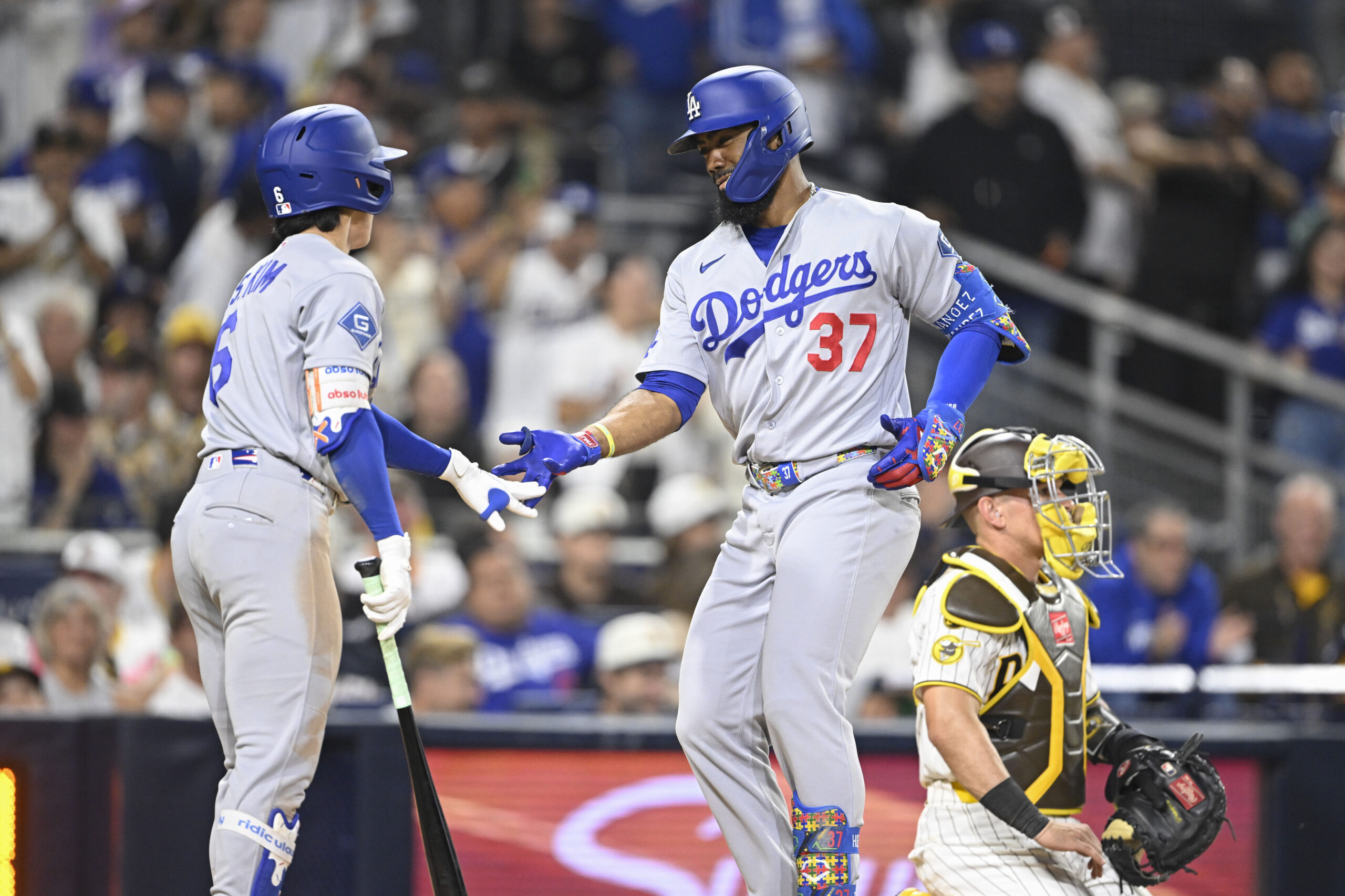 May 20, 2026; San Diego, California, USA; Los Angeles Dodgers left fielder Teoscar Hernandez (37) is congratulated by second baseman Hyeseong Kim (6) after hitting a solo home run during the ninth inning against the San Diego Padres at Petco Park. Mandatory Credit: Denis Poroy-Imagn Images