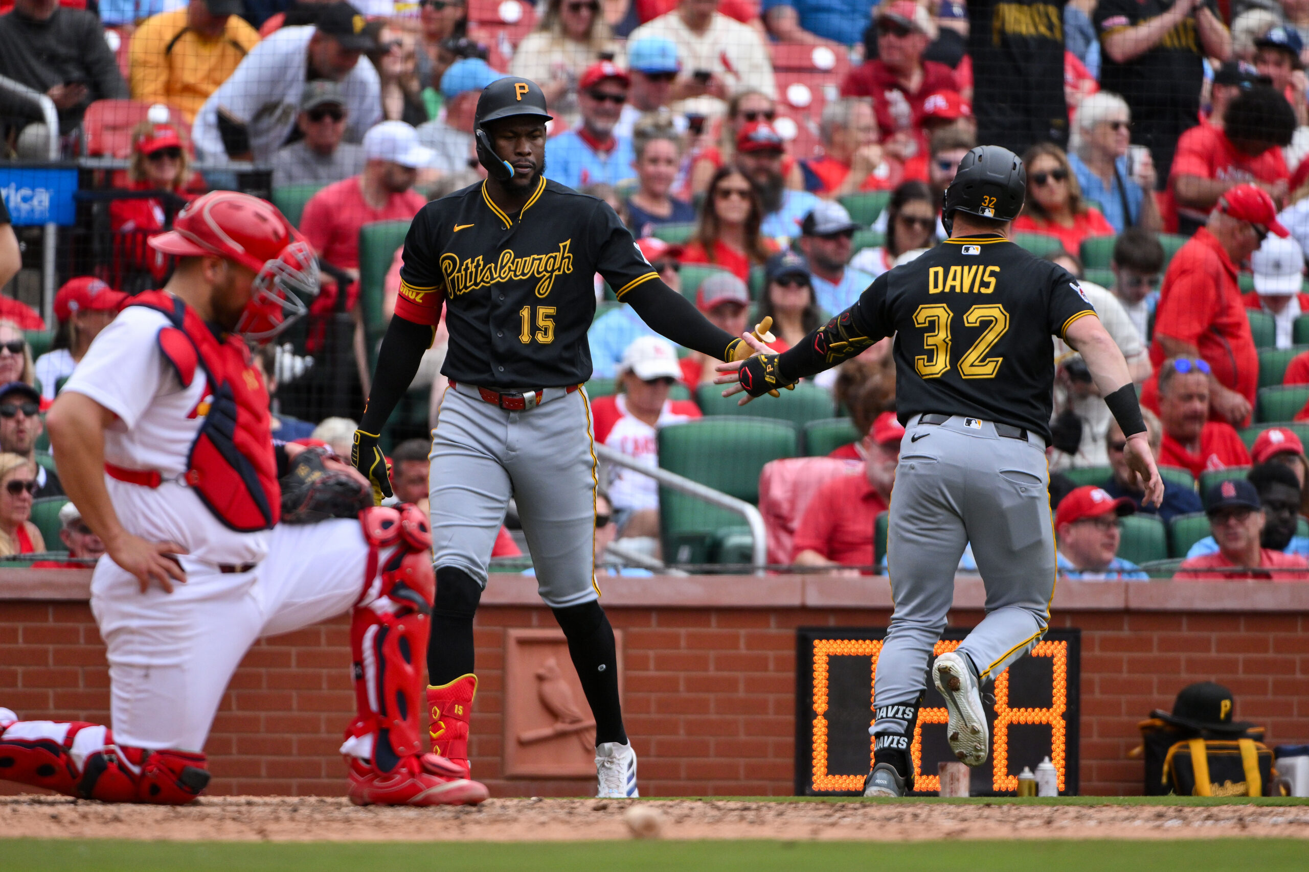 May 21, 2026; St. Louis, Missouri, USA; Pittsburgh Pirates catcher Henry Davis (32) is congratulated by center fielder Oneil Cruz (15) after hitting a solo home run against the St. Louis Cardinals during the seventh inning at Busch Stadium. Mandatory Credit: Jeff Curry-Imagn Images