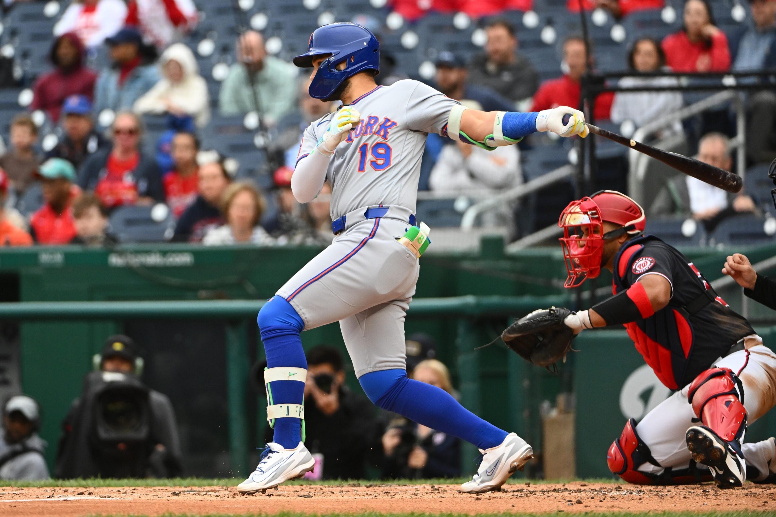May 21, 2026; Washington, District of Columbia, USA; New York Mets shortstop Bo Bichette (19) hits a two RBI single against the Washington Nationals during the third inning at Nationals Park. Mandatory Credit: Brad Mills-Imagn Images