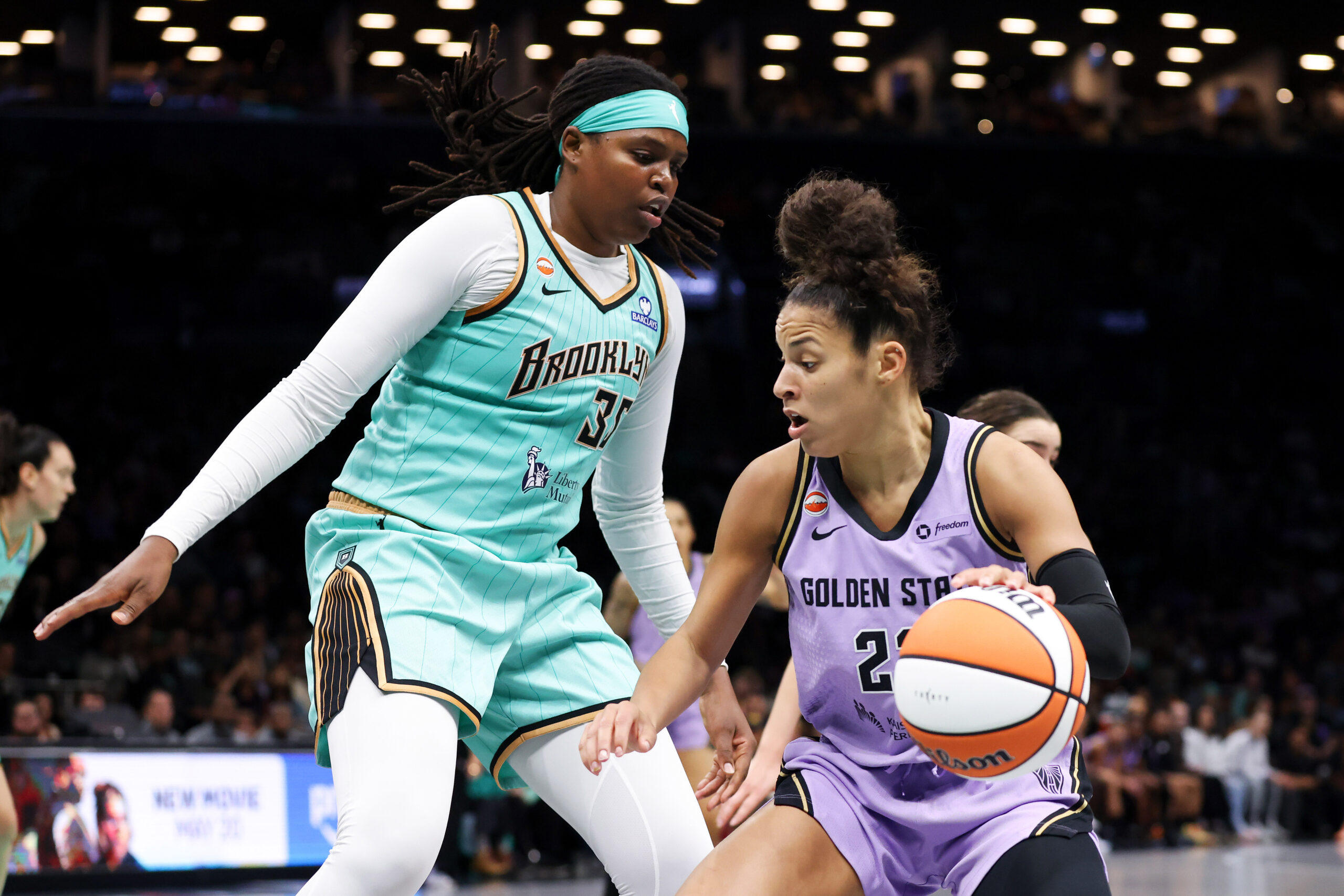 May 21, 2026; Brooklyn, New York, USA; Golden State Valkyries guard Veronica Burton (22) drives to the basket against New York Liberty center Jonquel Jones (35) during the first half at Barclays Center. Mandatory Credit: Tom Horak-Imagn Images