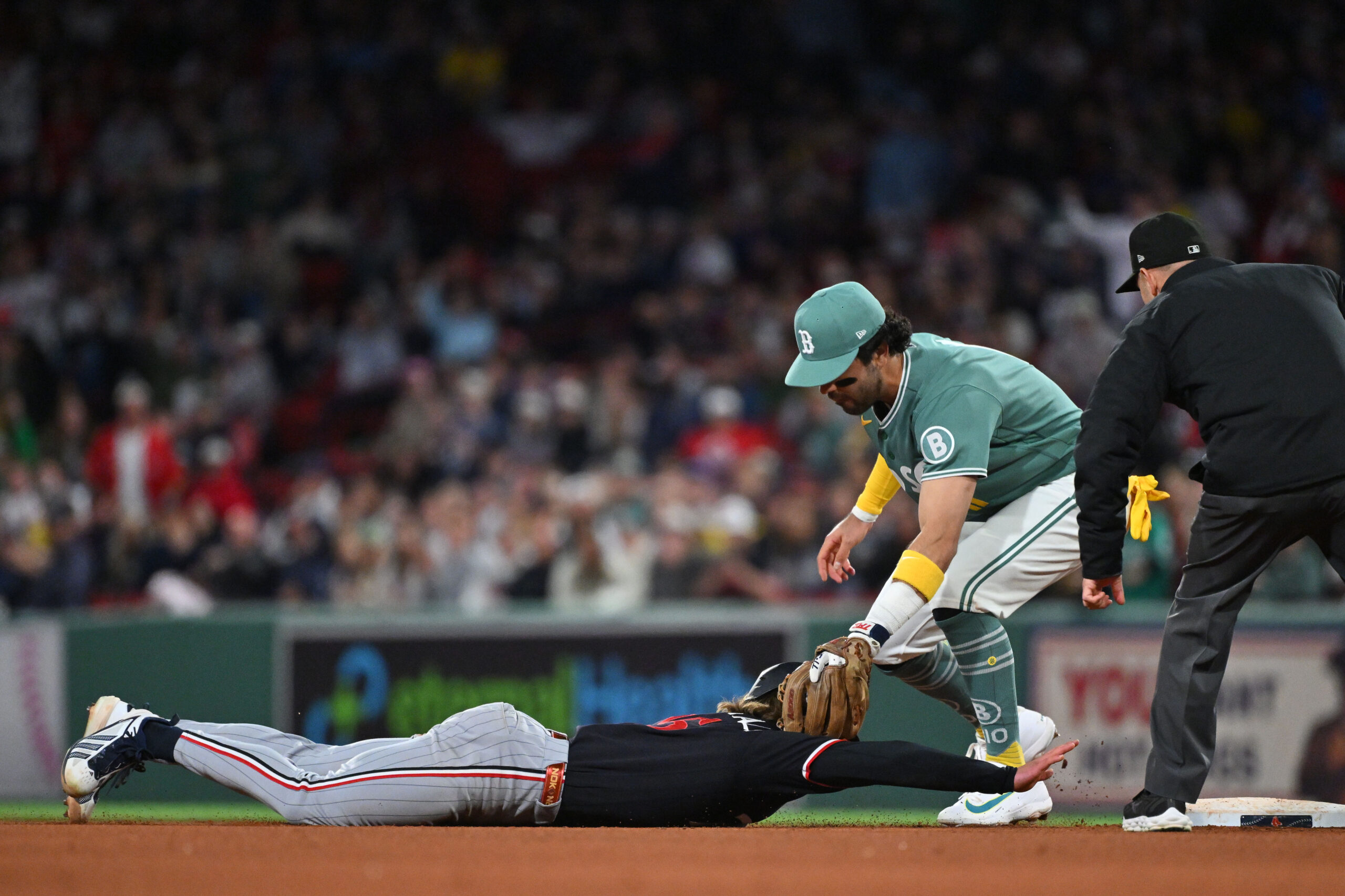 May 22, 2026; Boston, Massachusetts, USA; Minnesota Twins second baseman Luke Keaschall (15) is tagged out by Boston Red Sox second baseman Marcelo Mayer (11) during the eighth inning at Fenway Park. Mandatory Credit: Eric Canha-Imagn Images