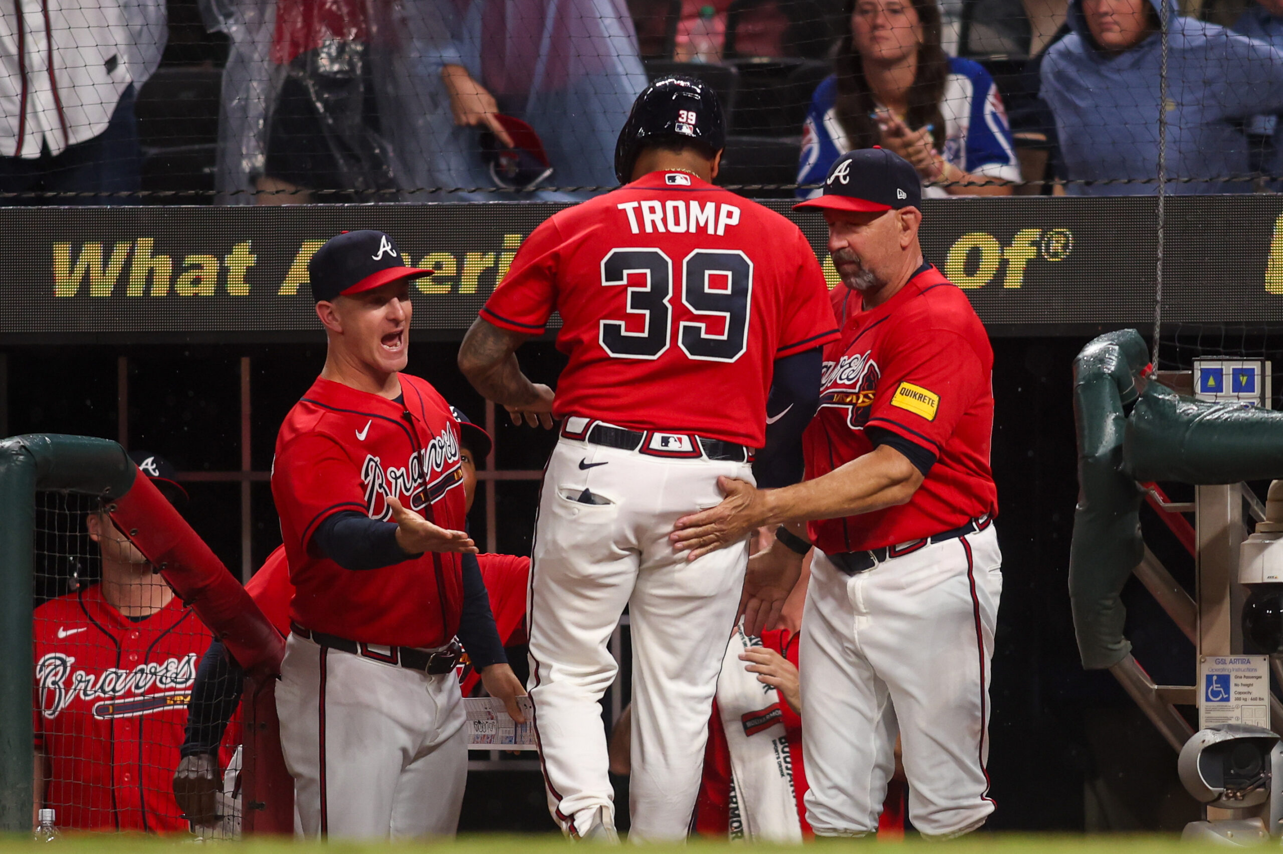 May 22, 2026; Atlanta, Georgia, USA; Atlanta Braves catcher Chadwick Tromp (39) celebrates with bench coach Tony Mansolino (89) and manager Walt Weiss (22) after scoring a run against the Washington Nationals in the tenth inning at Truist Park. Mandatory Credit: Brett Davis-Imagn Images