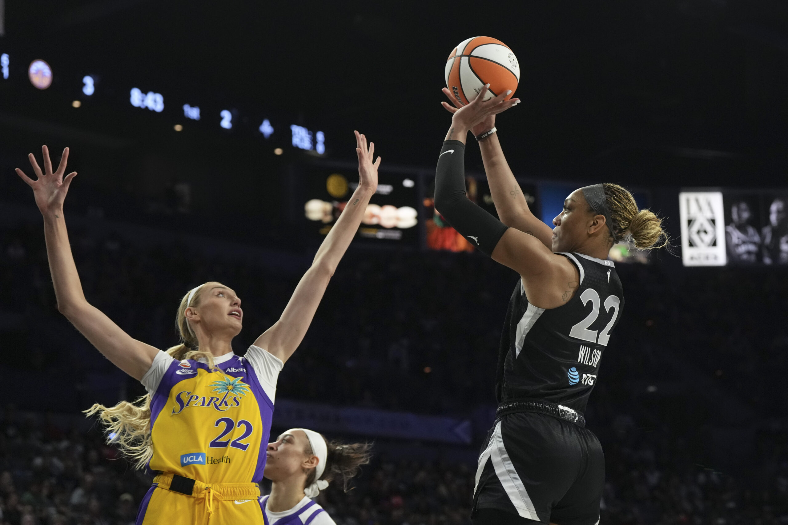 May 23, 2026; Las Vegas, Nevada, USA;  Las Vegas Aces center A'ja Wilson (22) shoots against Los Angeles Sparks forward Cameron Brink (22) in the first quarter of their game at Michelob Ultra Arena. Mandatory Credit: Candice Ward-Imagn Images