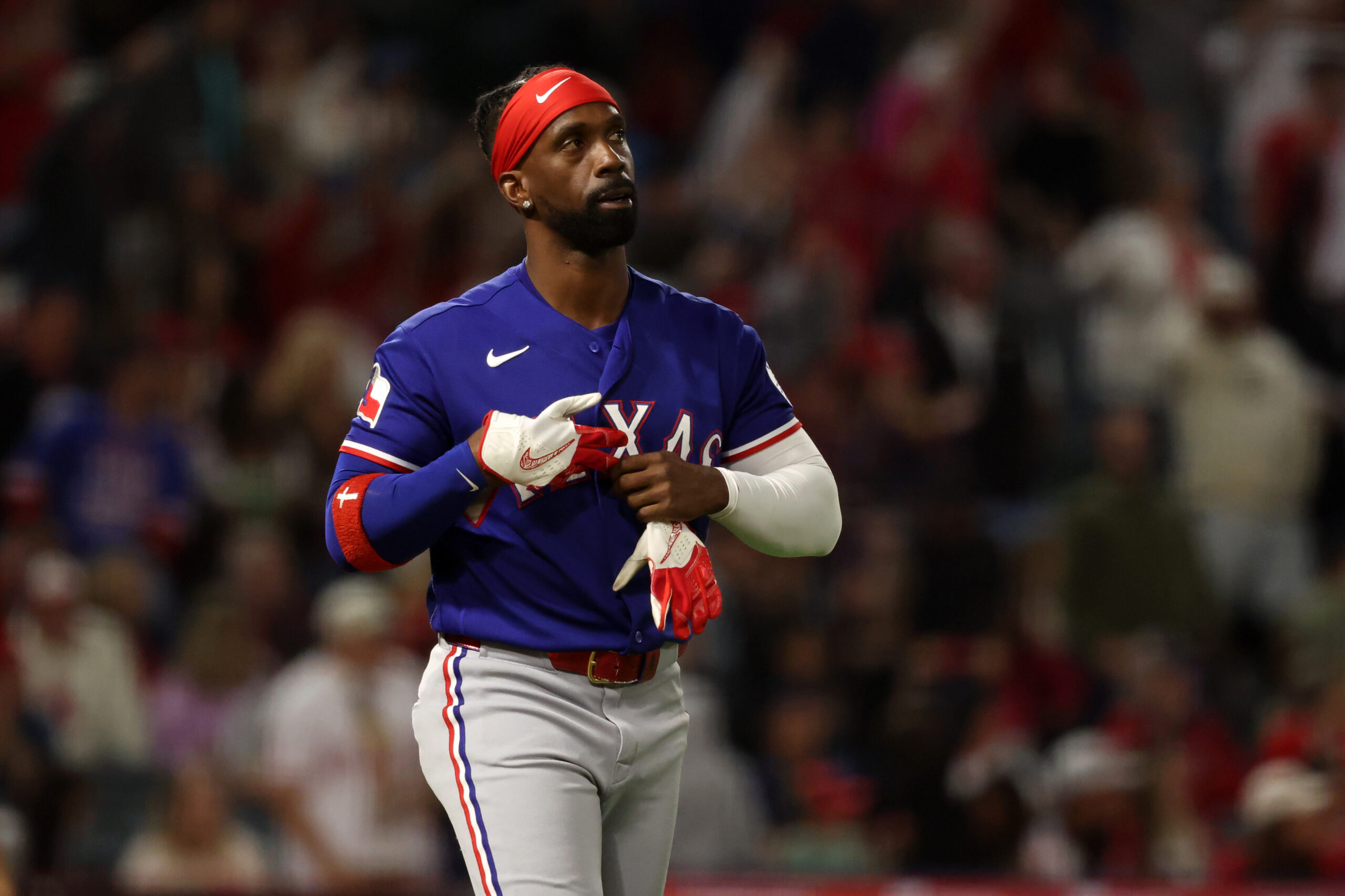 May 23, 2026; Anaheim, California, USA;  Texas Rangers pinch hitter Andrew McCutchen (4) reacts after strike out during the seventh inning against the Los Angeles Angels at Angel Stadium. Mandatory Credit: Kiyoshi Mio-Imagn Images