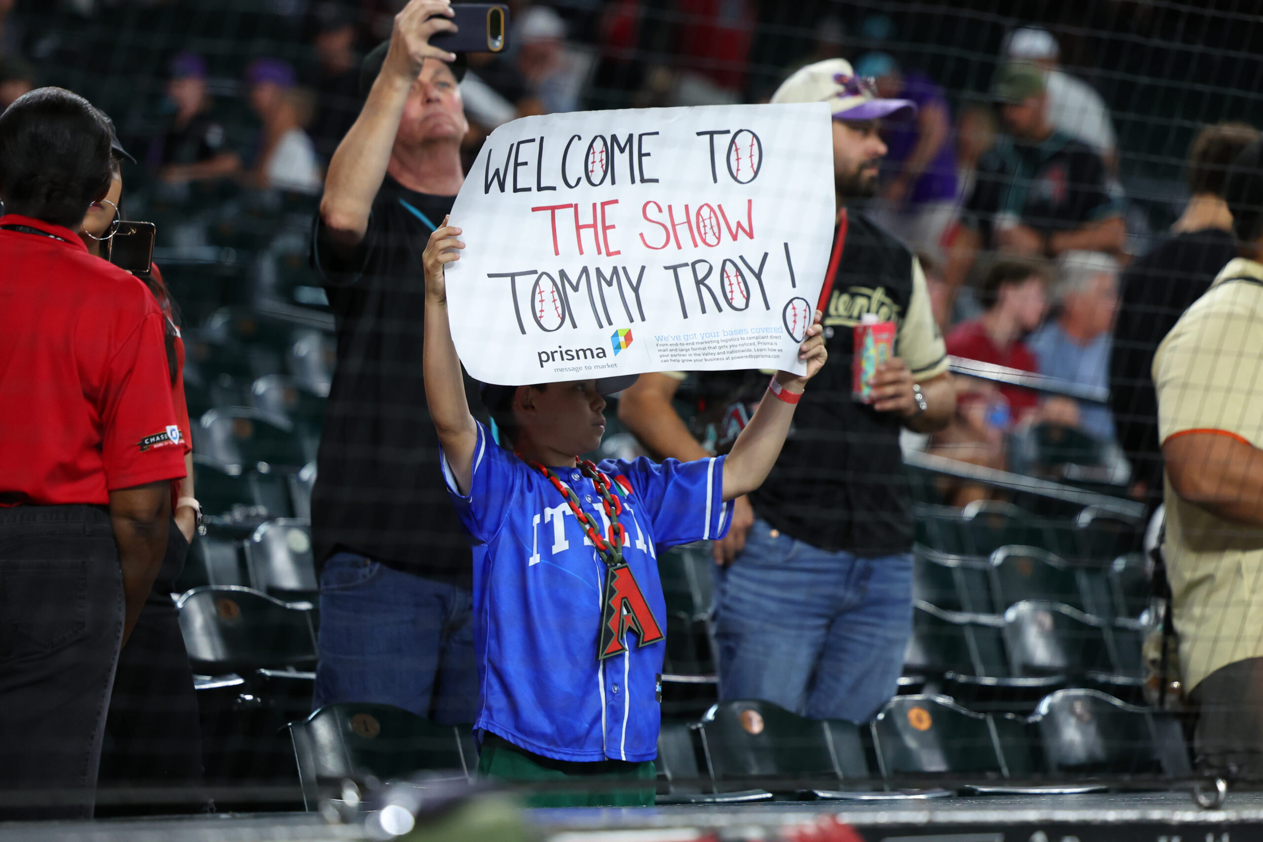May 24, 2026; Phoenix, Arizona, USA; Fans welcome Arizona Diamondbacks right fielder Tommy Troy (9) Major League Debut against the Colorado Rockies after the game at Chase Field. Mandatory Credit: Anna Carrington-Imagn Images