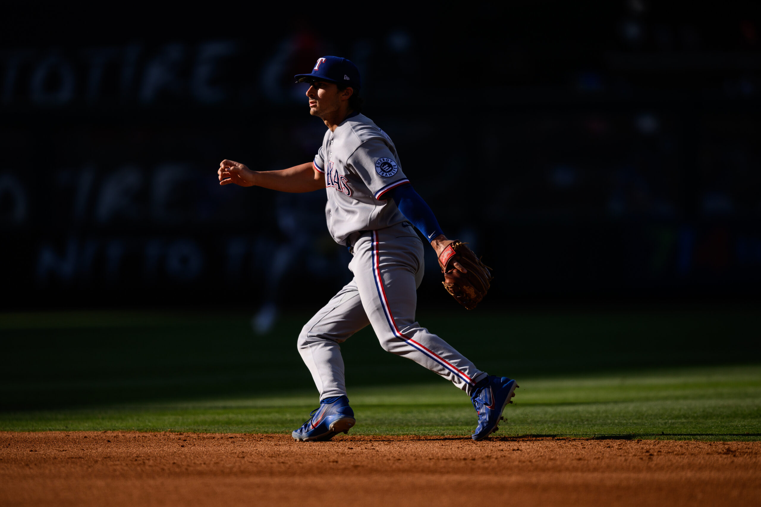 May 24, 2026; Anaheim, California, USA; Texas Rangers second baseman Justin Foscue (14) chases a ball during the sixth inning against the Los Angeles Angels at Angel Stadium. Mandatory Credit: William Liang-Imagn Images
