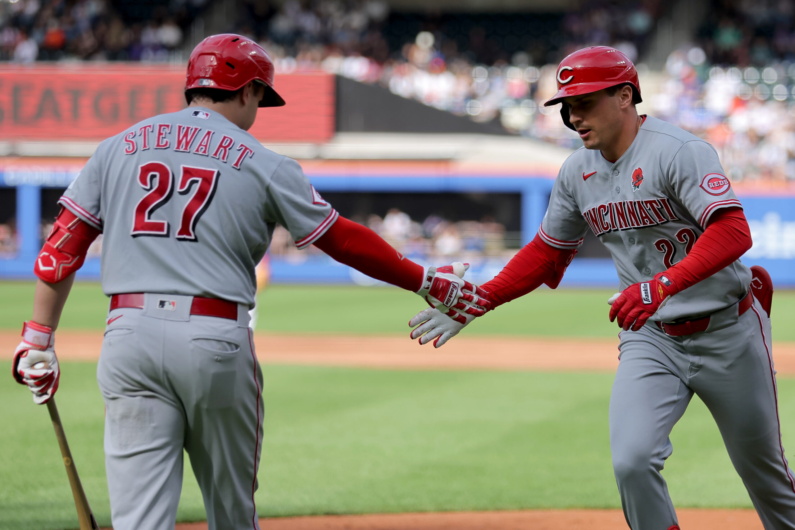 May 25, 2026; New York City, New York, USA; Cincinnati Reds left fielder JJ Bleday (22) celebrates his solo home run against the New York Mets with third baseman Sal Stewart (27) during the third inning at Citi Field. Mandatory Credit: Brad Penner-Imagn Images