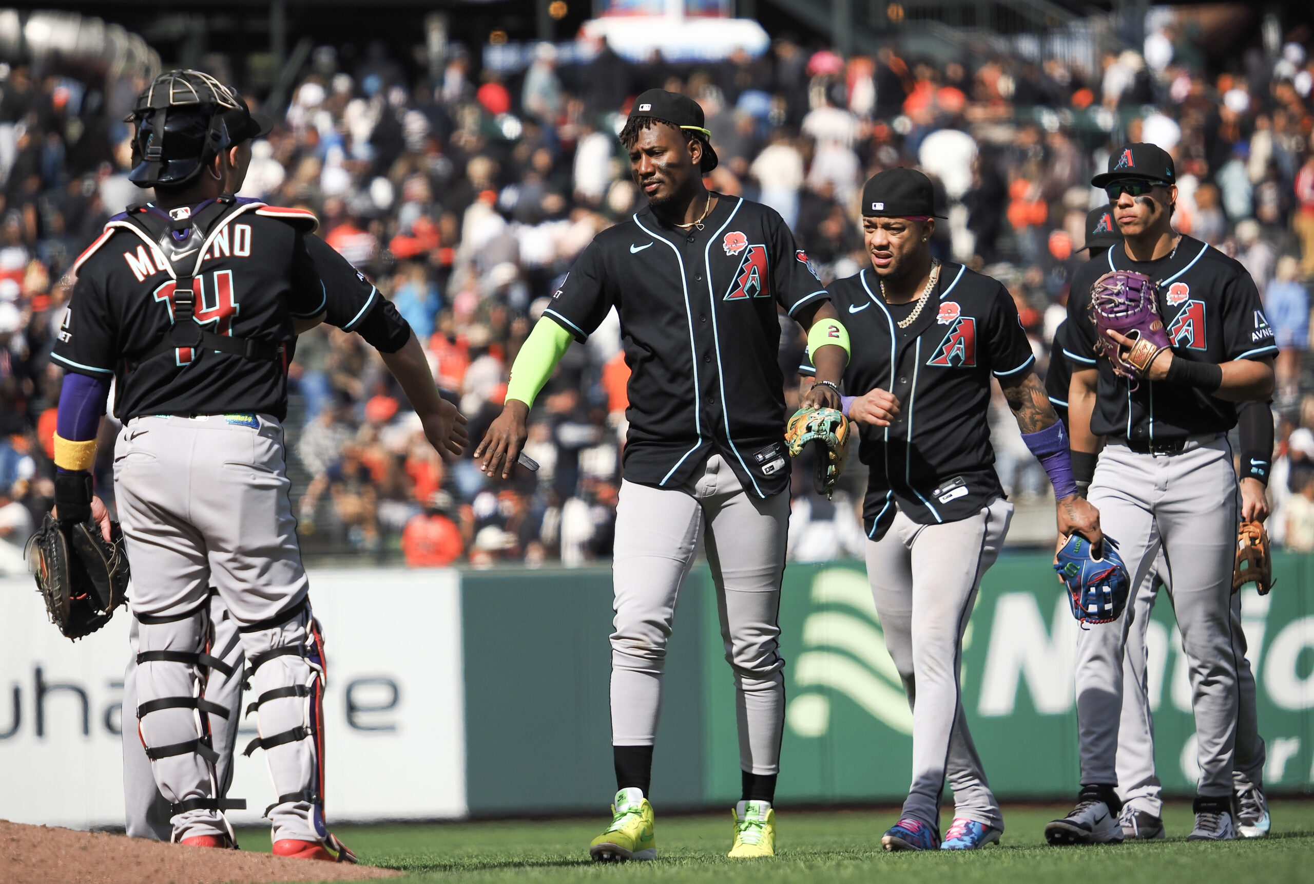 May 25, 2026; San Francisco, California, USA; Arizona Diamondbacks players high five after the game against the San Francisco Giants at Oracle Park. Mandatory Credit: Kelley L Cox-Imagn Images