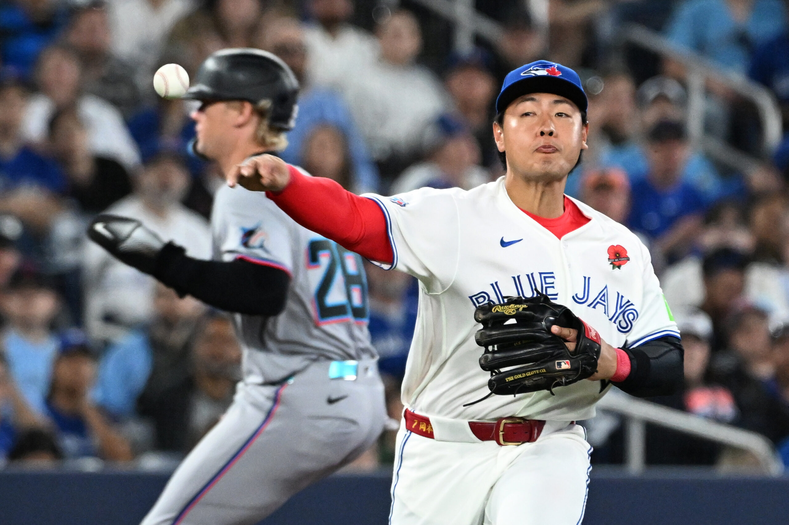 May 25, 2026; Toronto, Ontario, CAN;  Toronto Blue Jays third baseman Kazuma Okamoto (7) throws to first base to put out Miami Marlins center fielder Jakob Marsee (not shown) in the eighth inning at Rogers Centre. Mandatory Credit: Dan Hamilton-Imagn Images