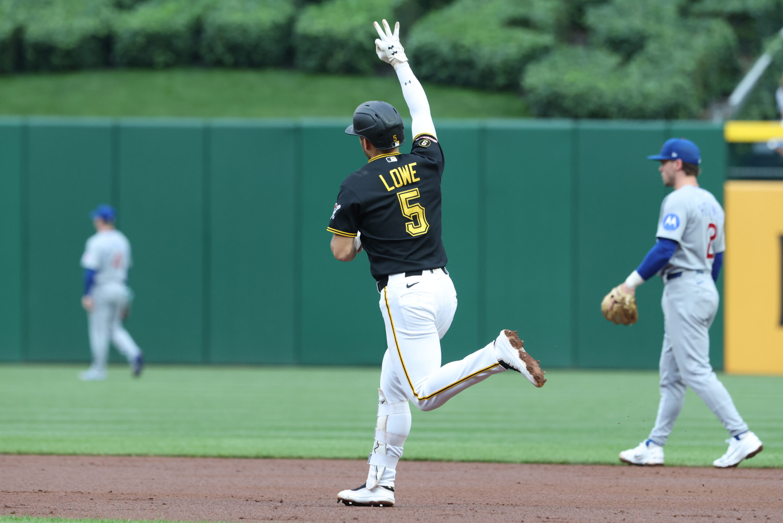 May 27, 2026; Pittsburgh, Pennsylvania, USA;  Pittsburgh Pirates second baseman Brandon Lowe (5) gestures as he circles the bases on a three-run home run against the Chicago Cubs during the third inning at PNC Park. Mandatory Credit: Charles LeClaire-Imagn Images