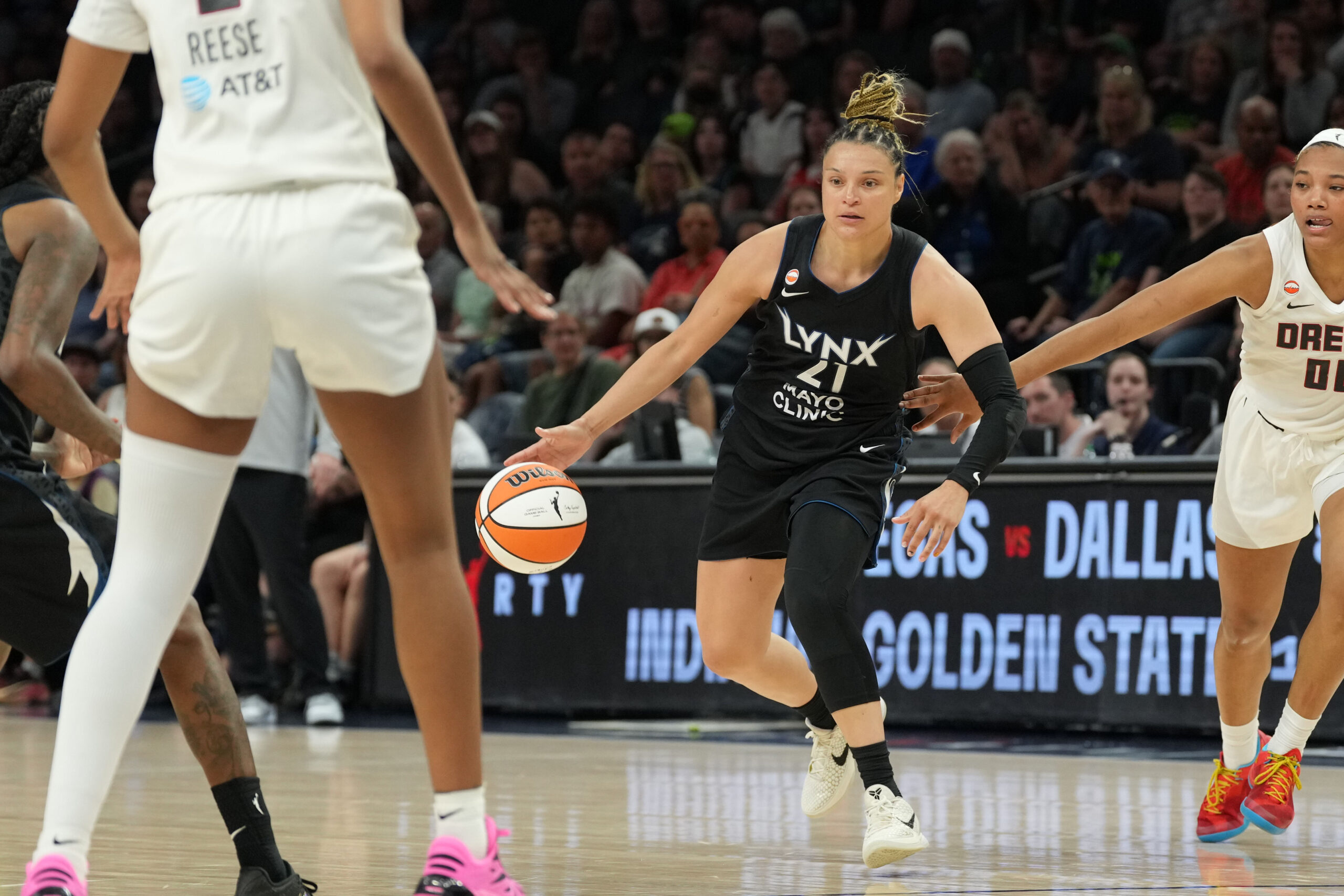 May 27, 2026; Minneapolis, Minnesota, USA; Minnesota Lynx guard Kayla McBride (21) dribbles the ball against the Atlanta Dream in the second half at Target Center. Mandatory Credit: Jesse Johnson-Imagn Images