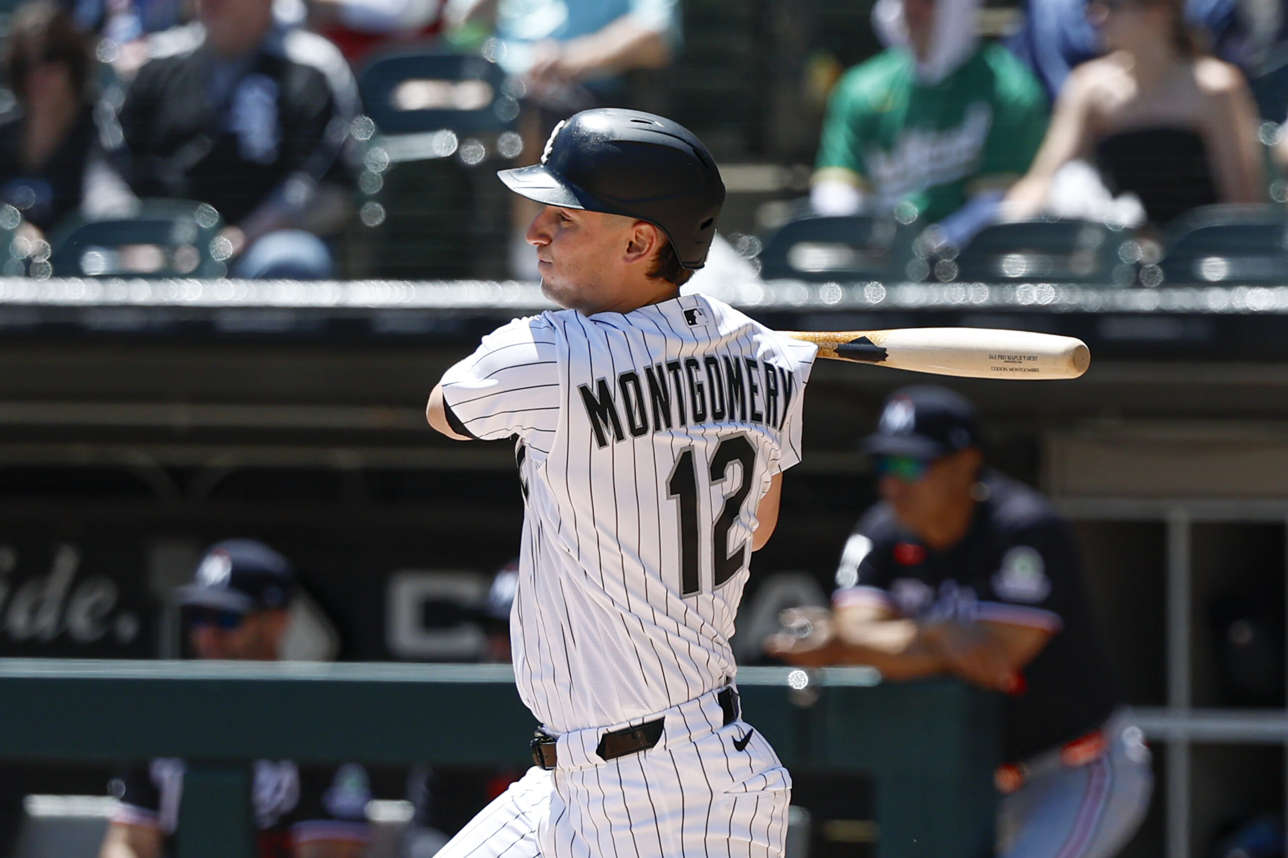 May 28, 2026; Chicago, Illinois, USA; Chicago White Sox shortstop Colson Montgomery (12) hits an RBI-single against the Minnesota Twins during the first inning at Rate Field. Mandatory Credit: Kamil Krzaczynski-Imagn Images