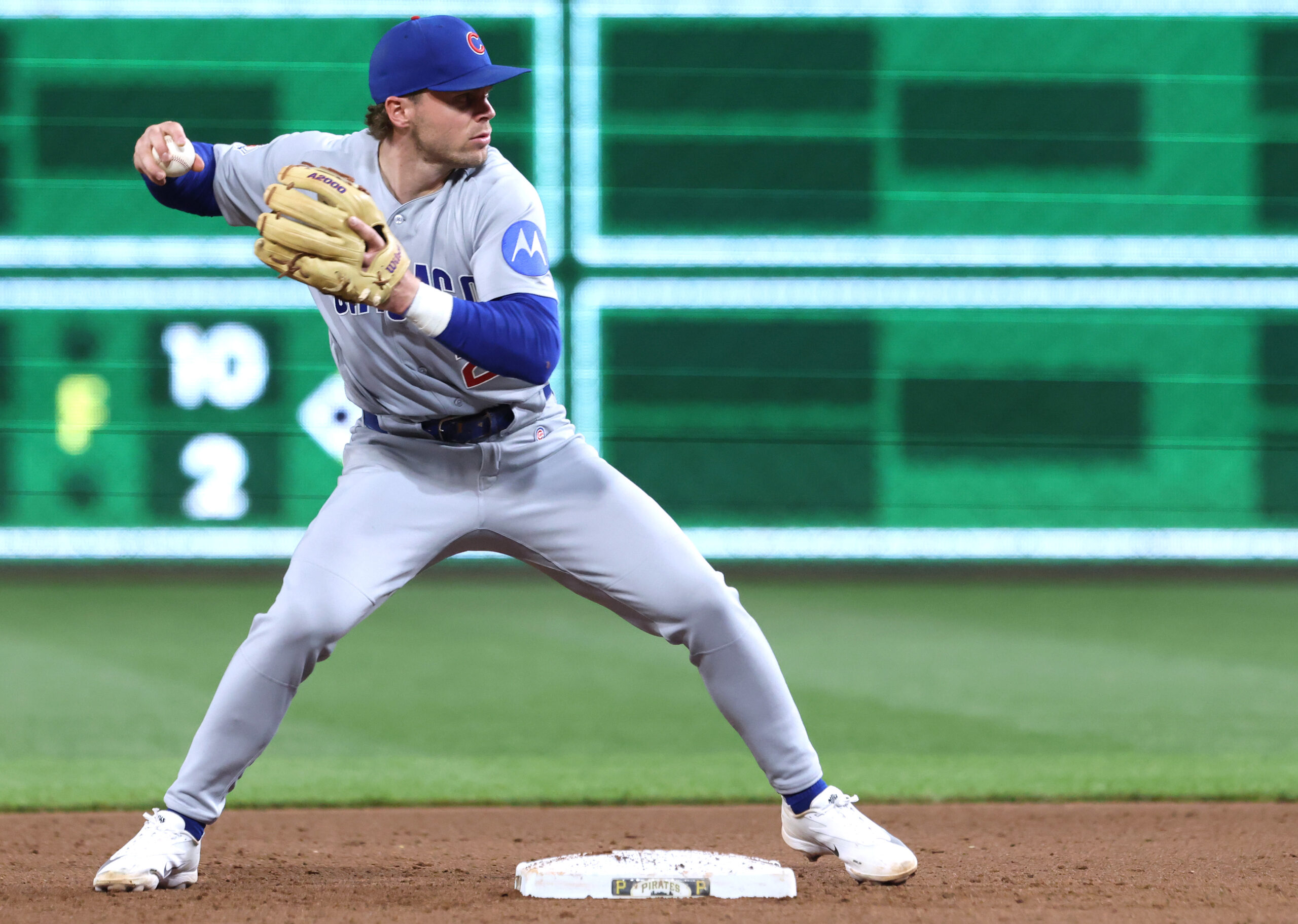 May 28, 2026; Pittsburgh, Pennsylvania, USA;  Chicago Cubs second baseman Nico Hoerner (2) throws to first base to complete a double play against the Pittsburgh Pirates during the ninth inning at PNC Park. Mandatory Credit: Charles LeClaire-Imagn Images