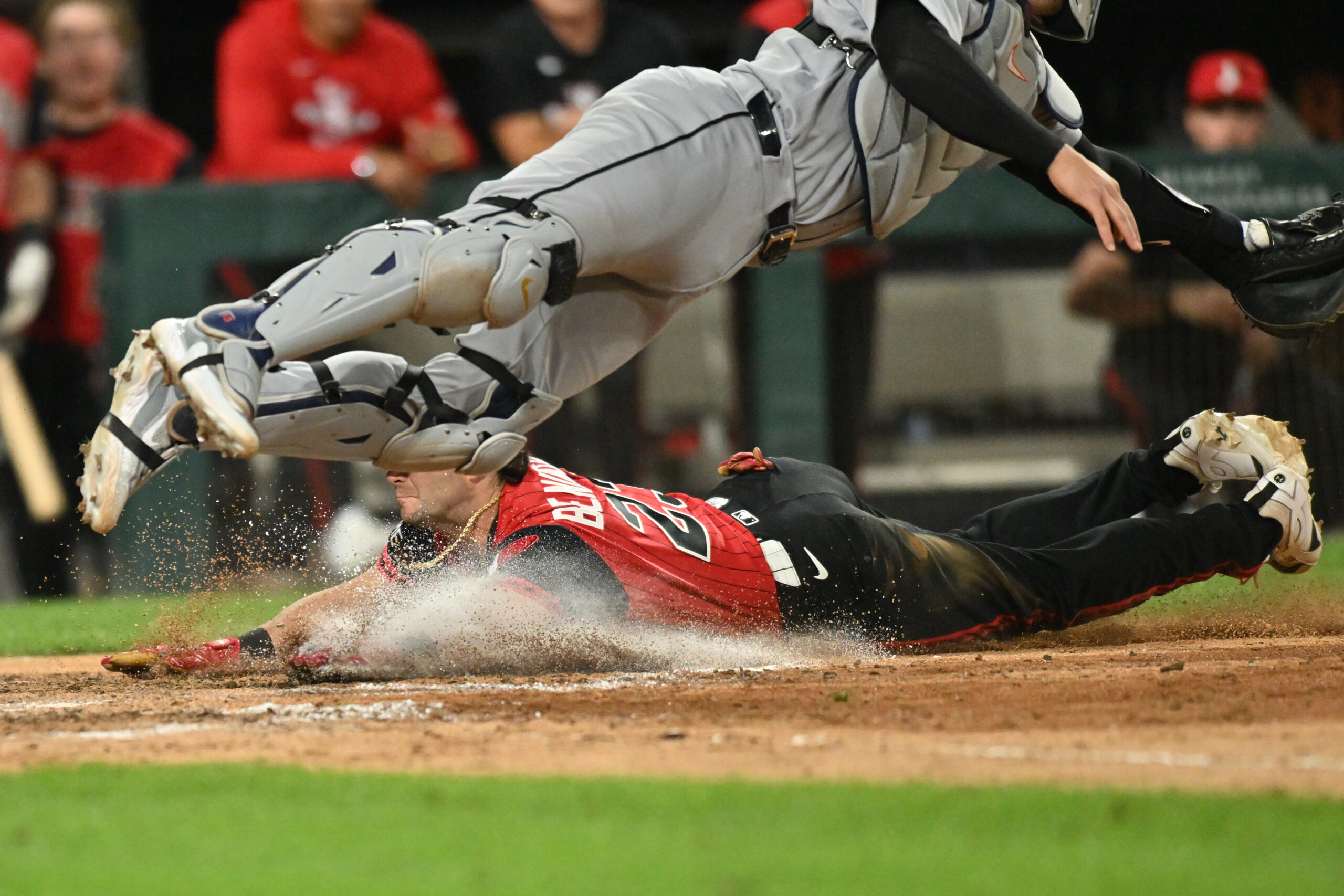 May 29, 2026; Chicago, Illinois, USA; Chicago White Sox designated hitter Andrew Benintendi (23) slides into home plate to score against the Detroit Tigers during the ninth inning at Rate Field. Mandatory Credit: Patrick Gorski-Imagn Images