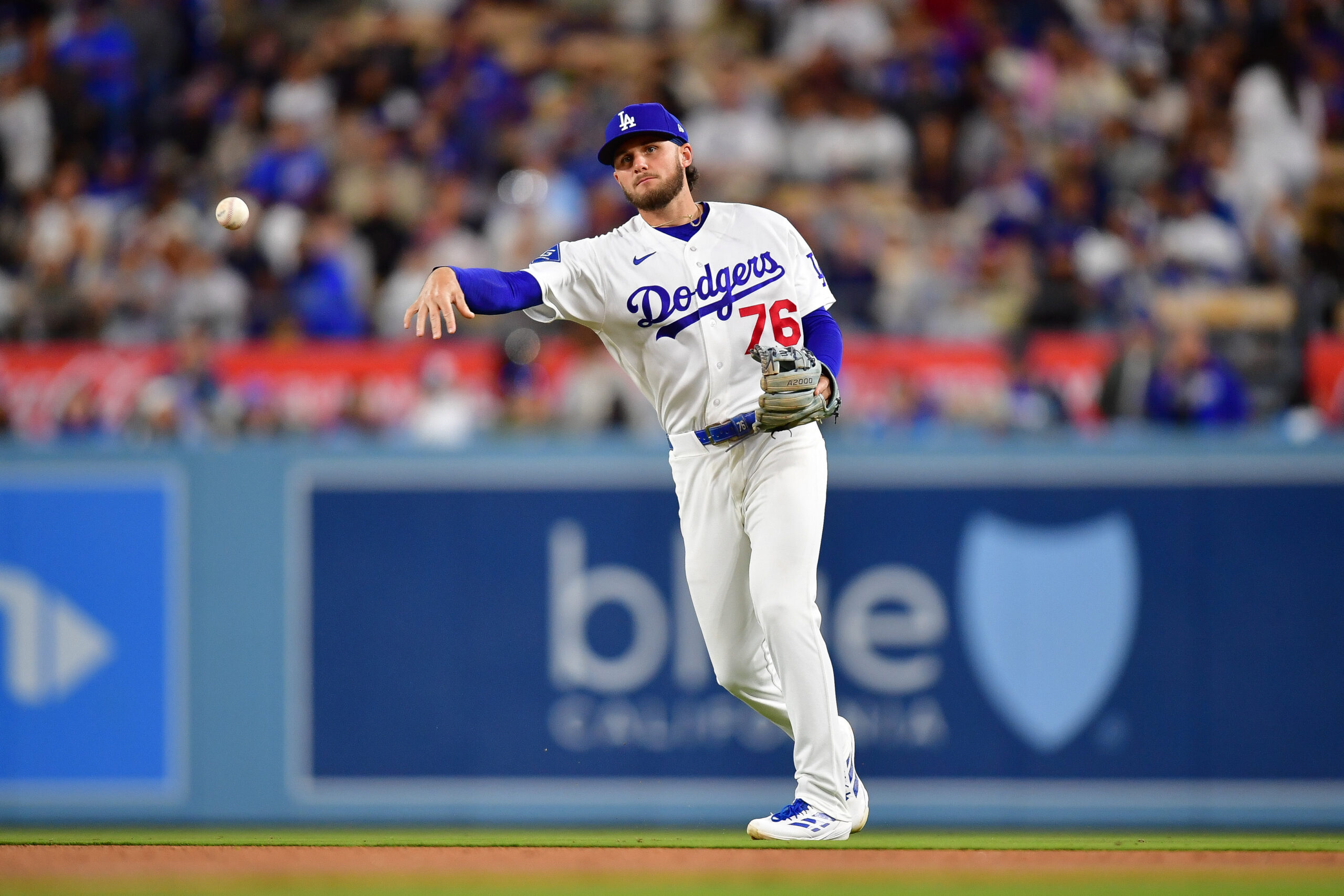 May 29, 2026; Los Angeles, California, USA; Los Angeles Dodgers second baseman Alex Freeland (76) throws to first for the out against Philadelphia Phillies first baseman Bryce Harper (3) during the seventh inning at Dodger Stadium. Mandatory Credit: Gary A. Vasquez-Imagn Images