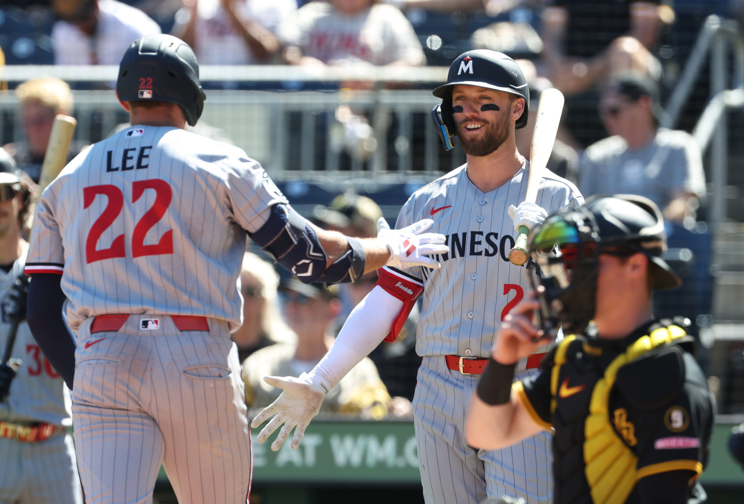 May 31, 2026; Pittsburgh, Pennsylvania, USA;  Minnesota Twins center fielder Kody Clemens (right) greets third baseman Brooks Lee (22) crossing home plate on a solo home run which was his second home run of the game during the ninth inning against the Pittsburgh Pirates at PNC Park. Mandatory Credit: Charles LeClaire-Imagn Images