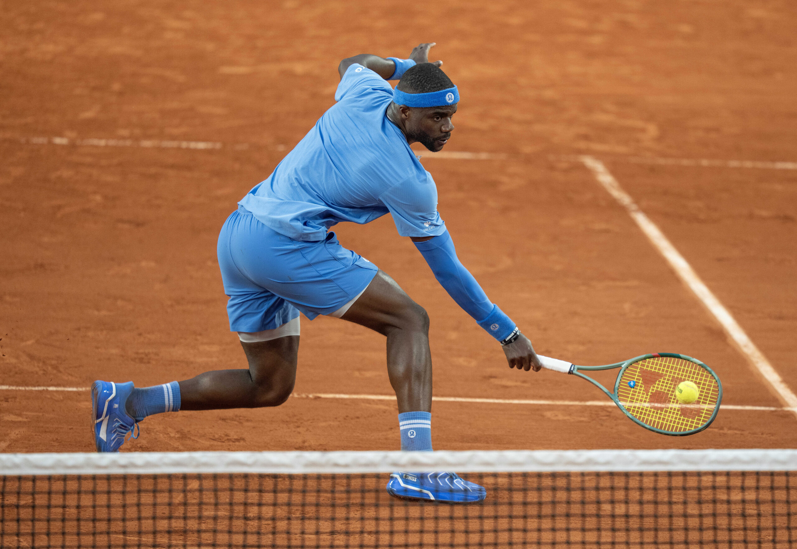 Jun 1, 2025; Paris, FR; Frances Tiafoe of the United States returns a shot during his match against Daniel Altmaier of Germany on day eight at Roland Garros Stadium. Mandatory Credit: Susan Mullane-Imagn Images