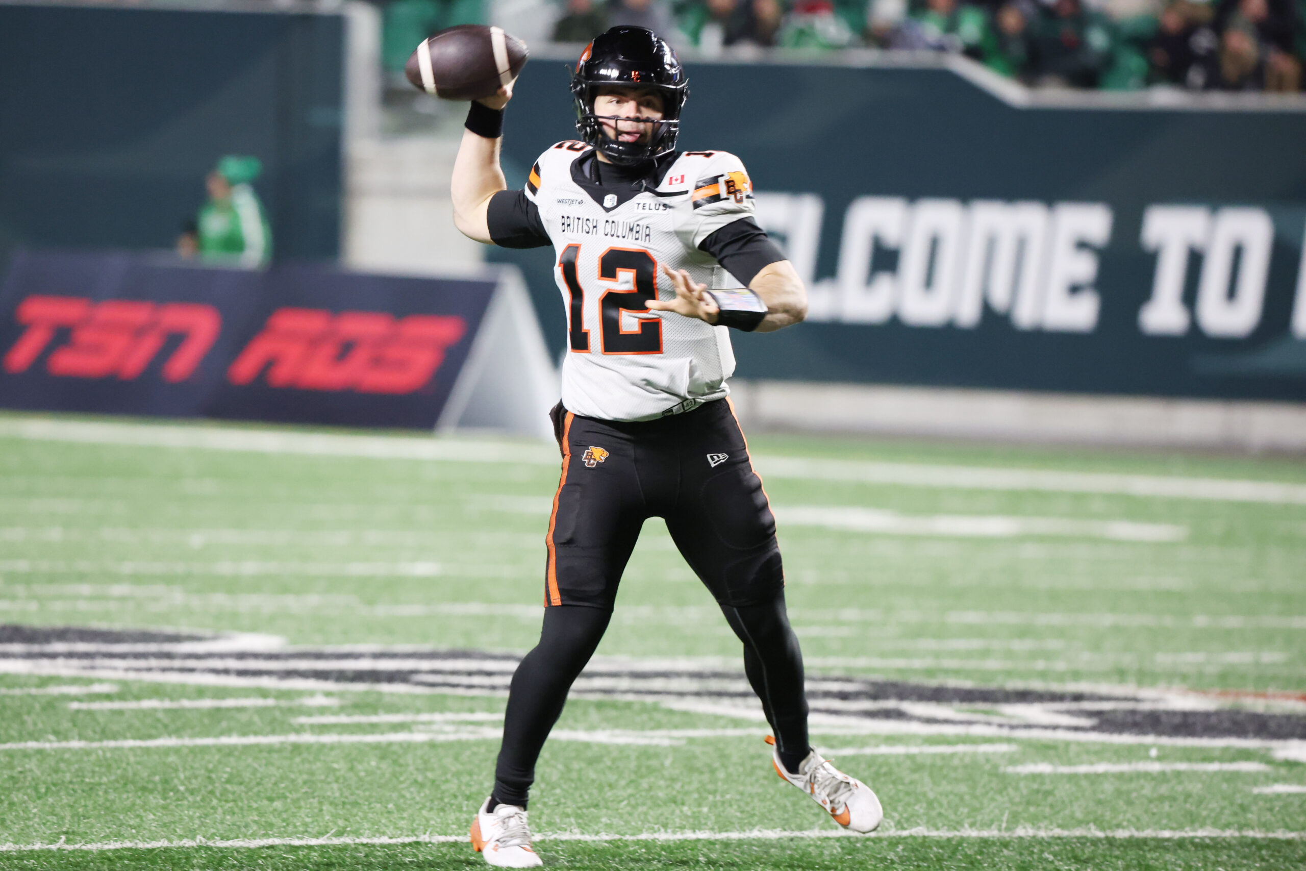 Nov 8, 2025; Regina, Saskatchewan, Canada;  BC Lions quarterback Nathan Rourke (12) looks for a receiver downfield during the second half of the CFL Western Conference Final between the BC Lions and the Saskatchewan Roughriders at Mosaic Stadium. Mandatory Credit: Bruce Fedyck-Imagn Images
