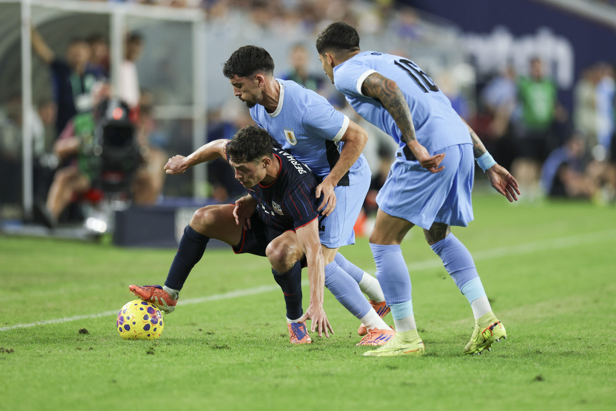Nov 18, 2025; Tampa, Florida, USA; United States midfielder Sebastian Berhalter (17) controls the ball from Uruguay defender Mathias Olivera (16) in the second half during an international friendly at Raymond James Stadium. Mandatory Credit: Nathan Ray Seebeck-Imagn Images