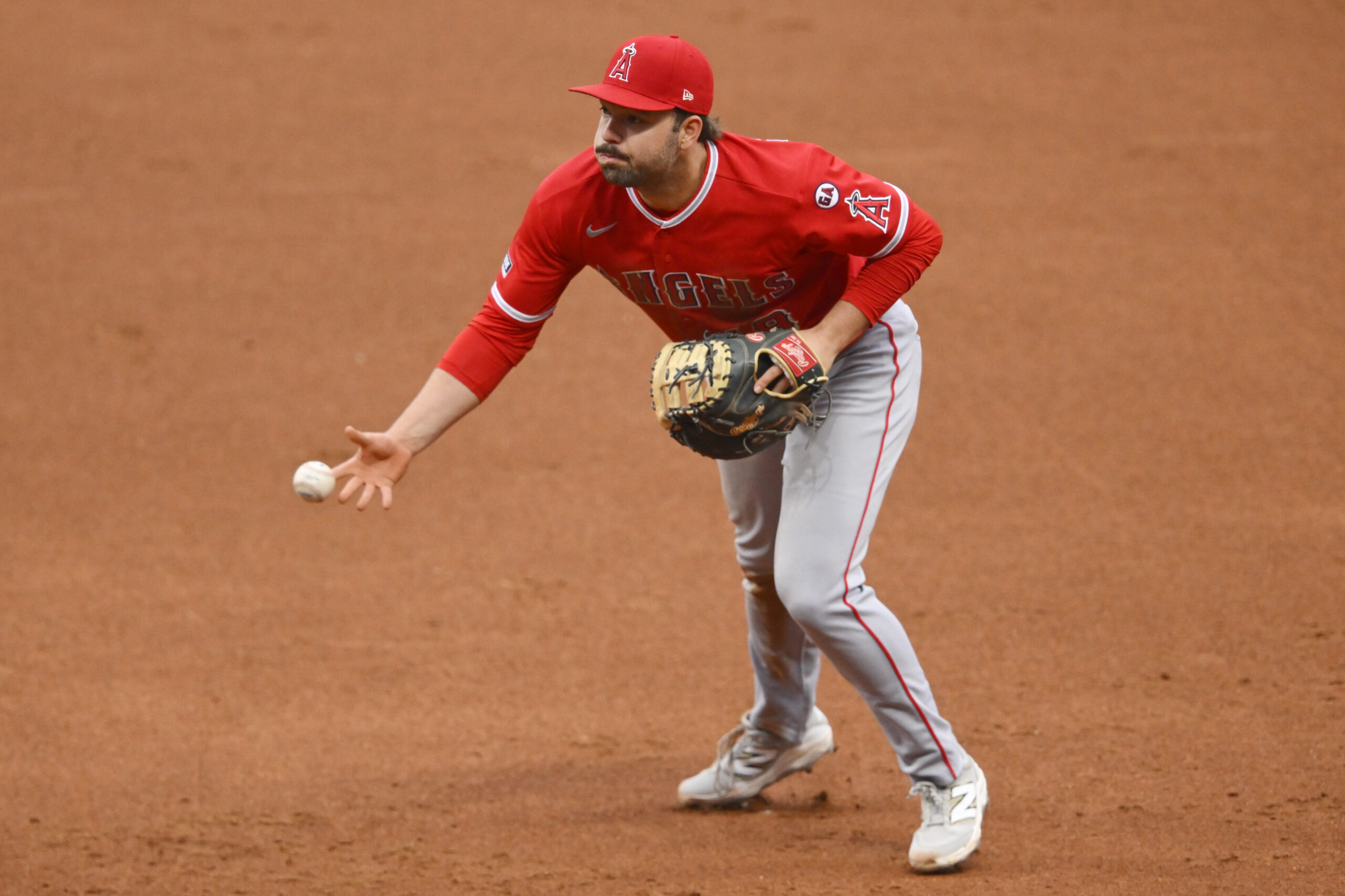 May 12, 2026; Cleveland, Ohio, USA; Los Angeles Angels first baseman Nolan Schanuel (18) tosses the ball to first in the third inning against the Cleveland Guardians at Progressive Field. Mandatory Credit: David Richard-Imagn Images