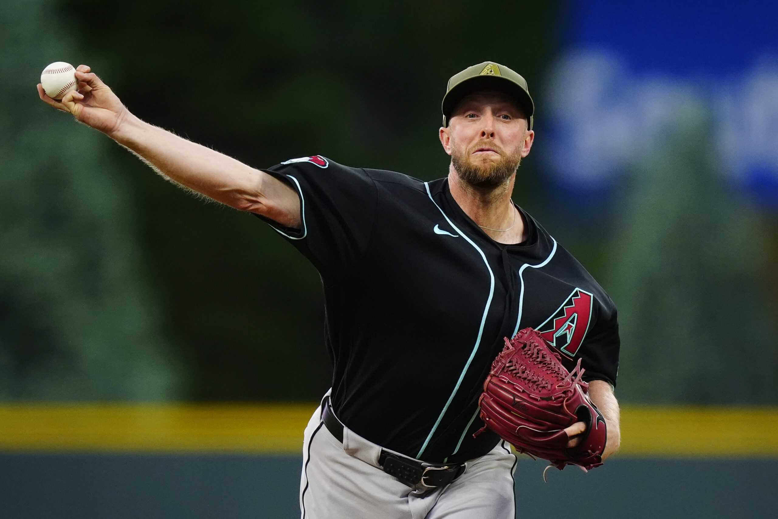 May 15, 2026; Denver, Colorado, USA; Arizona Diamondbacks starting pitcher Merrill Kelly (29) delivers a pitch in the first inning against the Colorado Rockies at Coors Field. Mandatory Credit: Ron Chenoy-Imagn Images