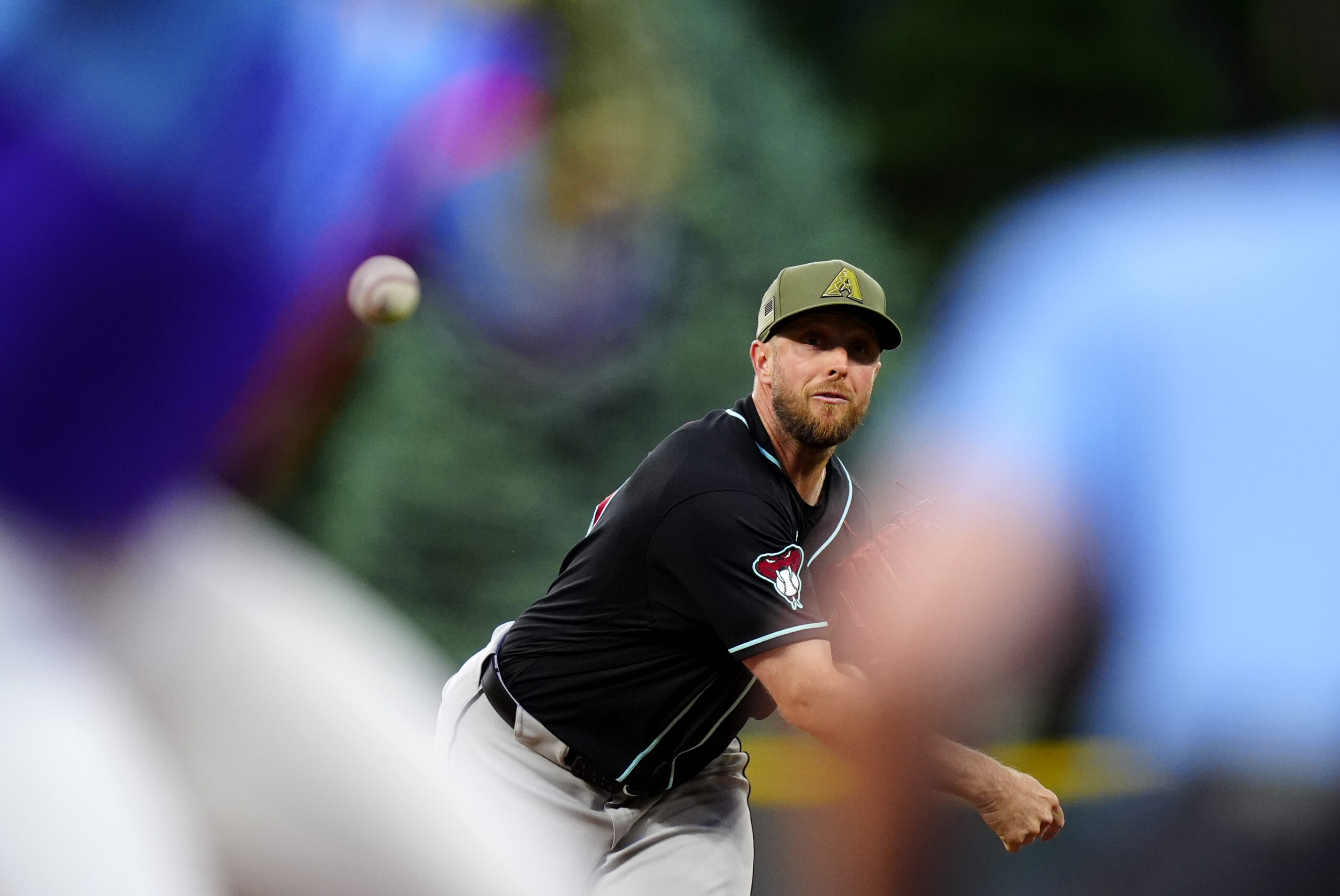 May 15, 2026; Denver, Colorado, USA; Arizona Diamondbacks starting pitcher Merrill Kelly (29) delivers a pitch in the first inning against the Colorado Rockies at Coors Field. Mandatory Credit: Ron Chenoy-Imagn Images