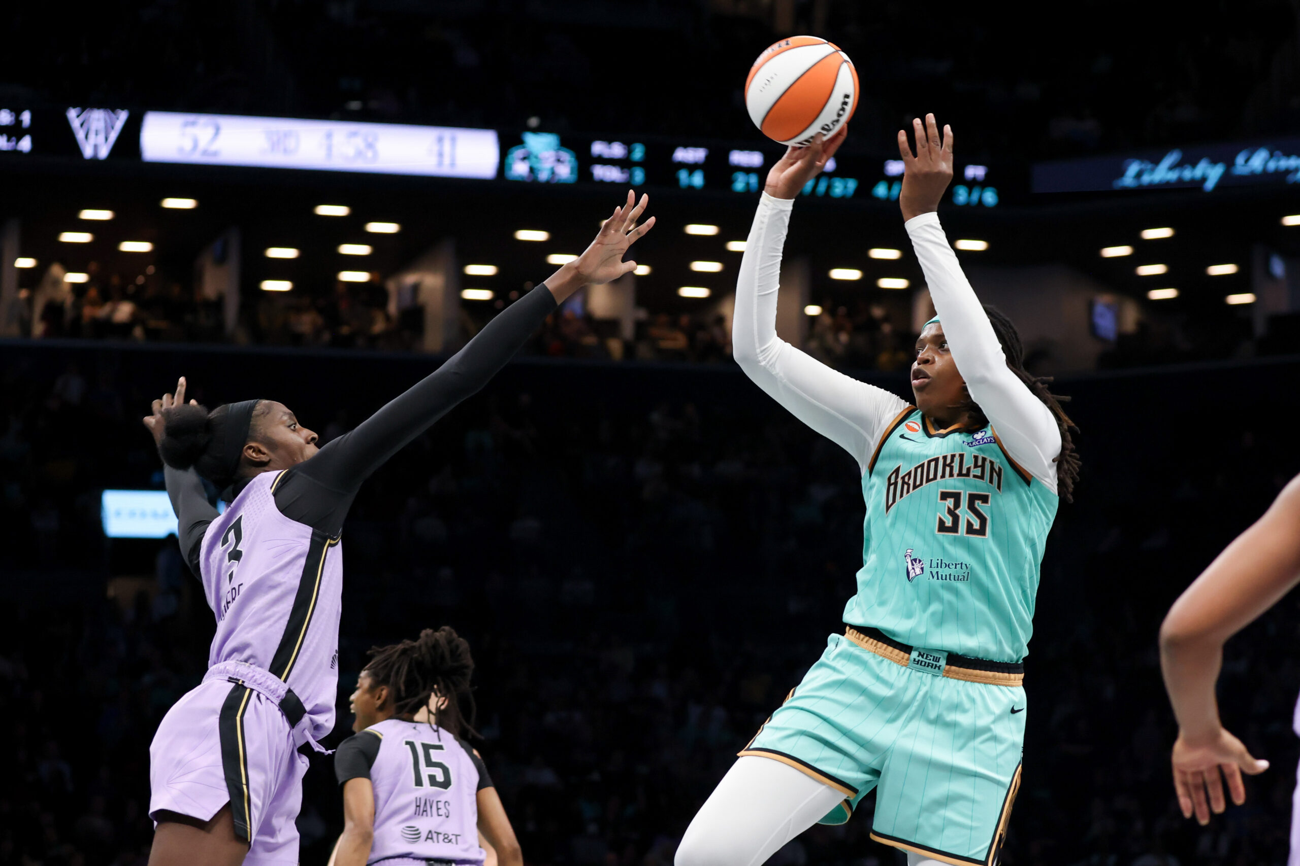 May 21, 2026; Brooklyn, New York, USA; New York Liberty center Jonquel Jones (35) shoots the ball against Golden State Valkyries forward Laeticia Amihere (3) during the third quarter at Barclays Center. Mandatory Credit: Tom Horak-Imagn Images