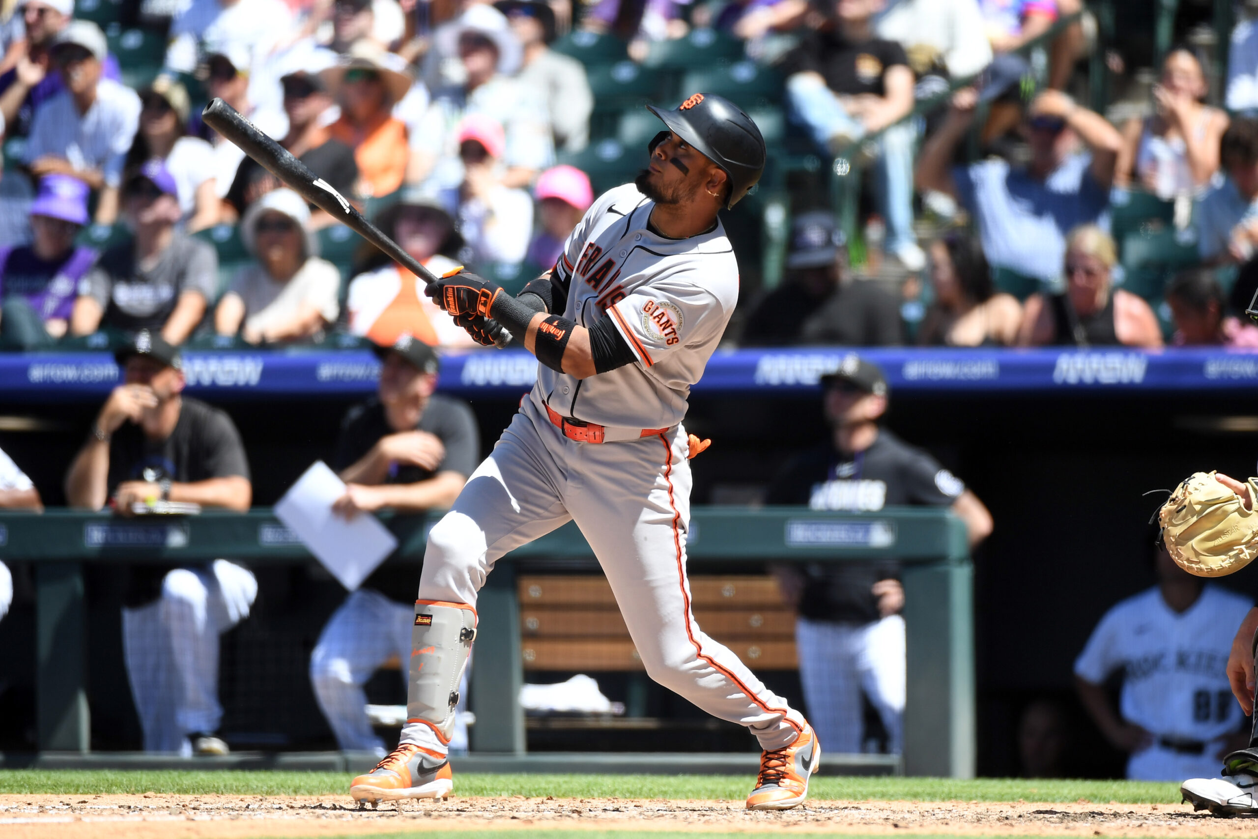 May 31, 2026; Denver, Colorado, USA; San Francisco Giants infielder Luis Arraez (1) hits an RBI sacrifice flyout in the fourth inning against the Colorado Rockies at Coors Field. Mandatory Credit: Christopher Hanewinckel-Imagn Images