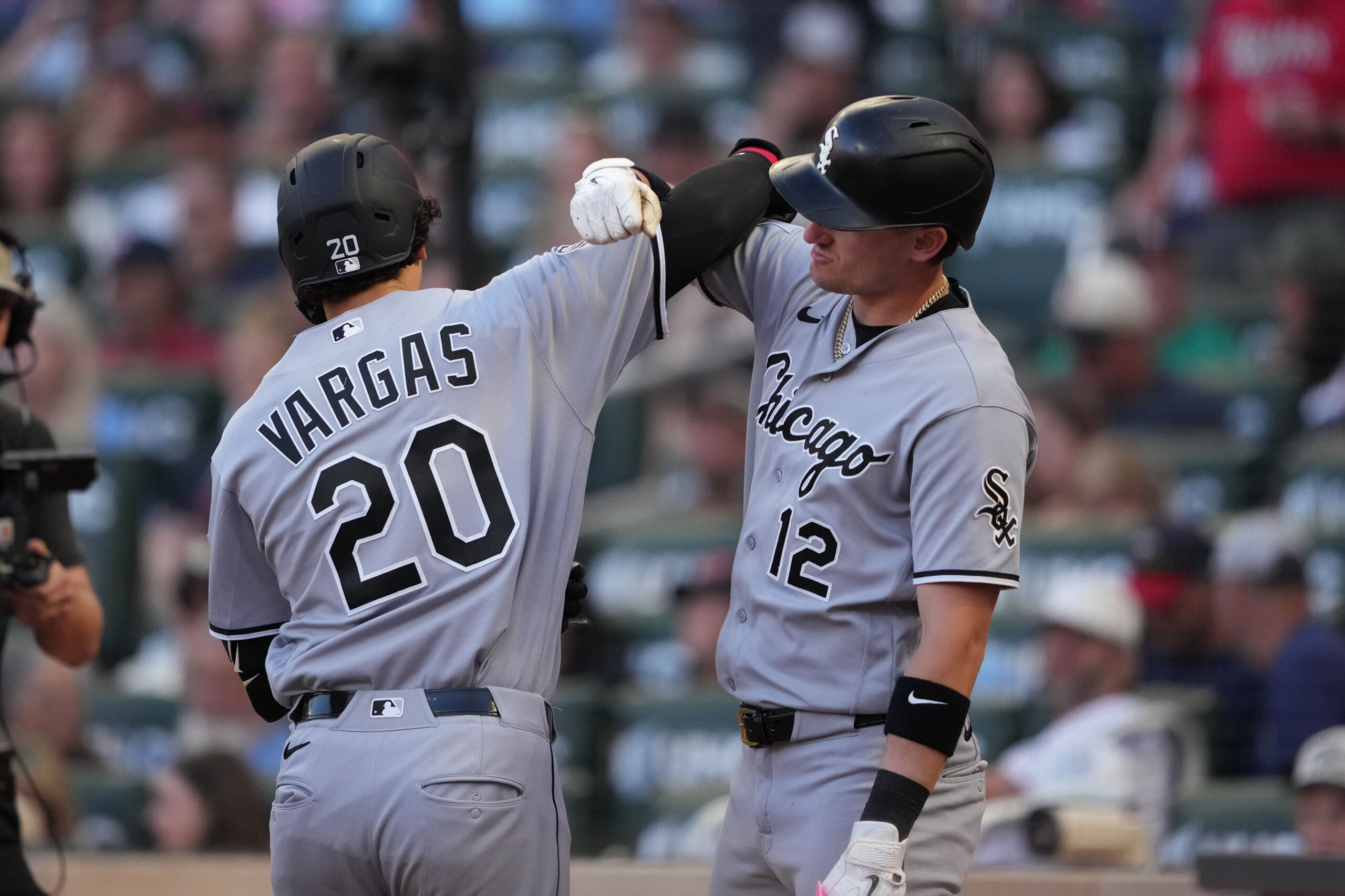 Jun 1, 2026; Minneapolis, Minnesota, USA; Chicago White Sox third baseman Miguel Vargas (20) celebrates with shortstop Colson Montgomery (12) after hitting a two run home run during the fifth inning against the Minnesota Twins at Target Field. Mandatory Credit: Jordan Johnson-Imagn Images