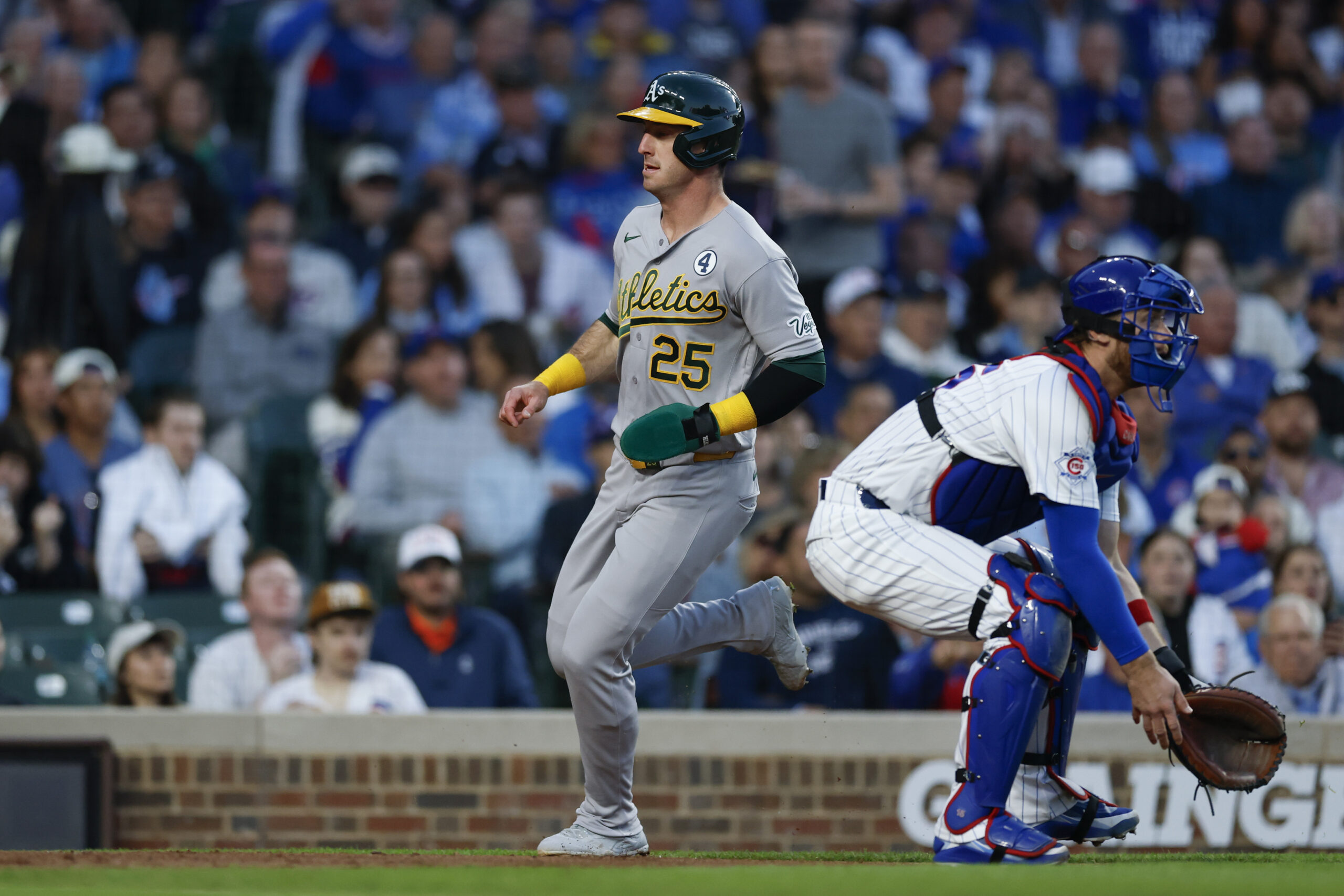 Jun 2, 2026; Chicago, Illinois, USA; Athletics designated hitter Brent Rooker (25) scores against the Chicago Cubs during the fourth inning at Wrigley Field. Mandatory Credit: Kamil Krzaczynski-Imagn Images